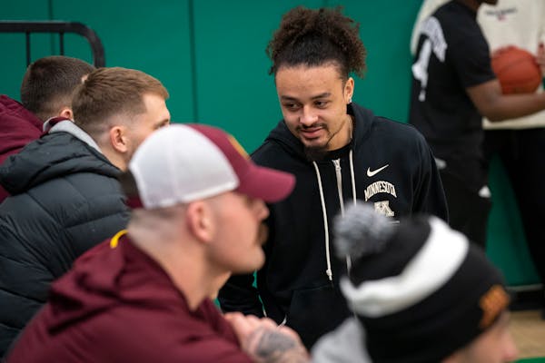 Gophers guard Braeden Carrington talked to fans during a basketball game at Park Center, where the former Pirate was honored during a 74-65 victory ov