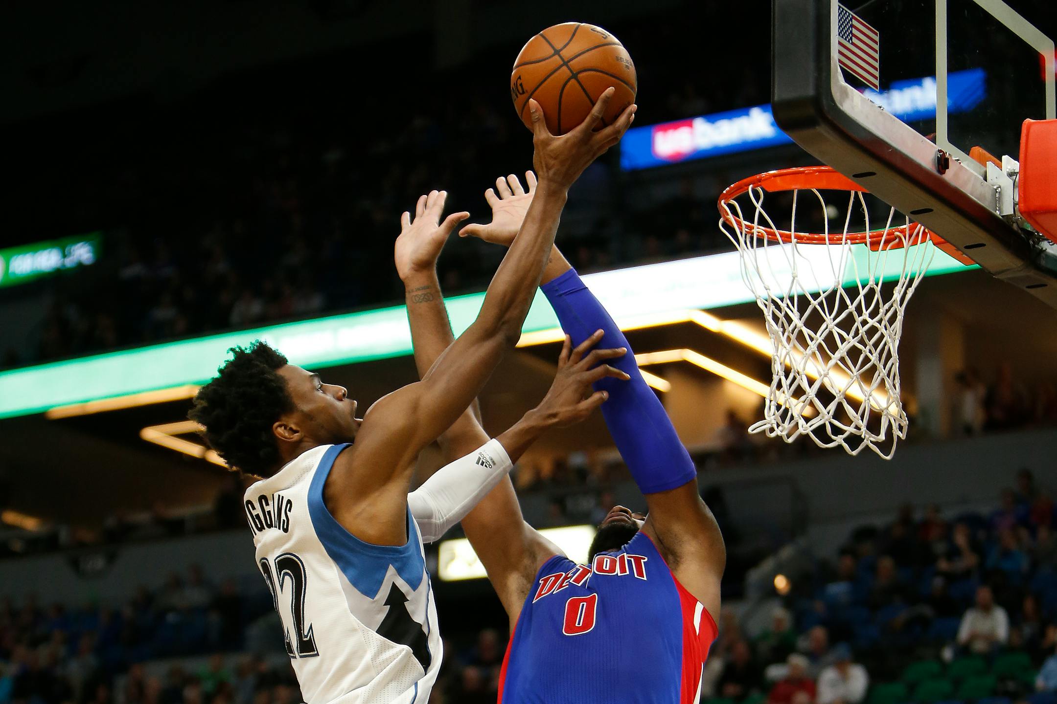 Minnesota Timberwolves forward Andrew Wiggins (22) shoots the ball over Detroit Pistons center Andre Drummond (0) in the first half of an NBA basketball game Friday, Dec. 9, 2016, in Minneapolis. (AP Photo/Stacy Bengs)