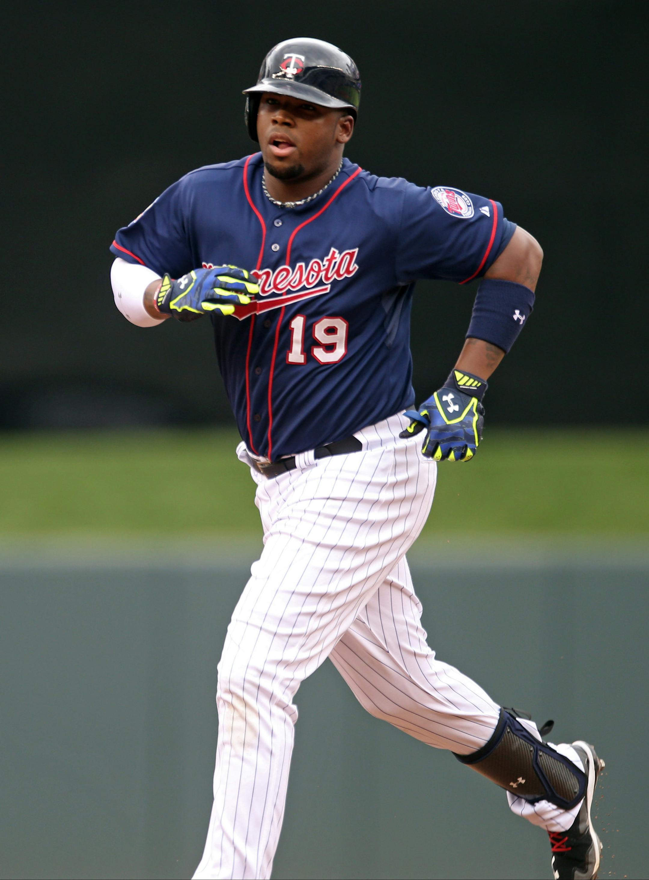Minnesota Twins first baseman Kennys Vargas rounds the bases on a solo home run off Cleveland Indians pitcher Corey Kluber in the fourth inning of a baseball game, Thursday, Aug. 21, 2014, in Minneapolis. (AP Photo/Jim Mone)