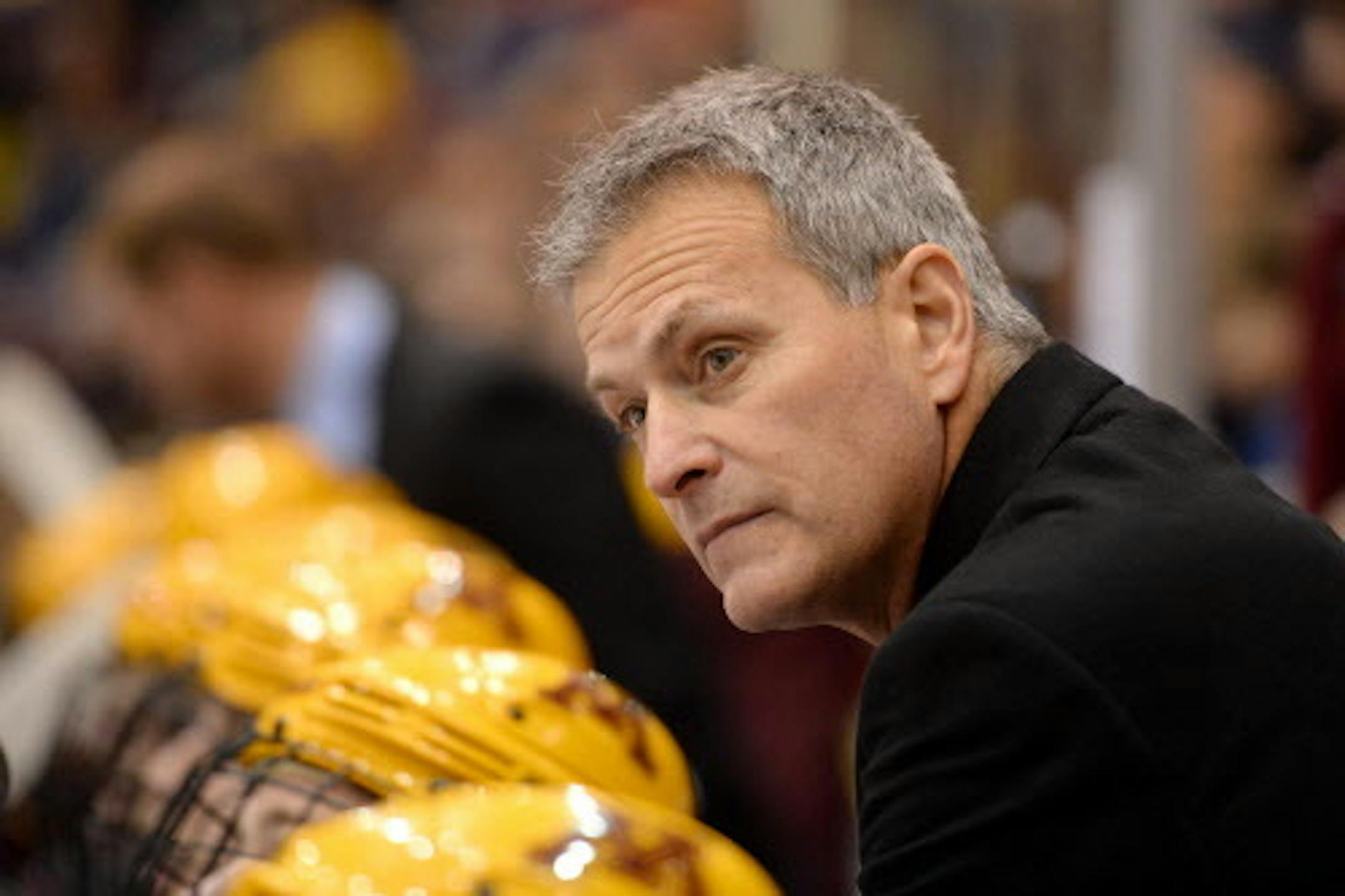 Minnesota Golden Gophers head coach Don Lucia watched the game during the third period.   ] (AARON LAVINSKY/STAR TRIBUNE) aaron.lavinsky@startribune.com  The University of Minnesota Golden Gophers men's hockey team played the Connecticut Huskies on Friday, Jan. 1, 2016 at Mariucci Arena in Minneapolis, Minn. ORG XMIT: MIN1601012208023652
