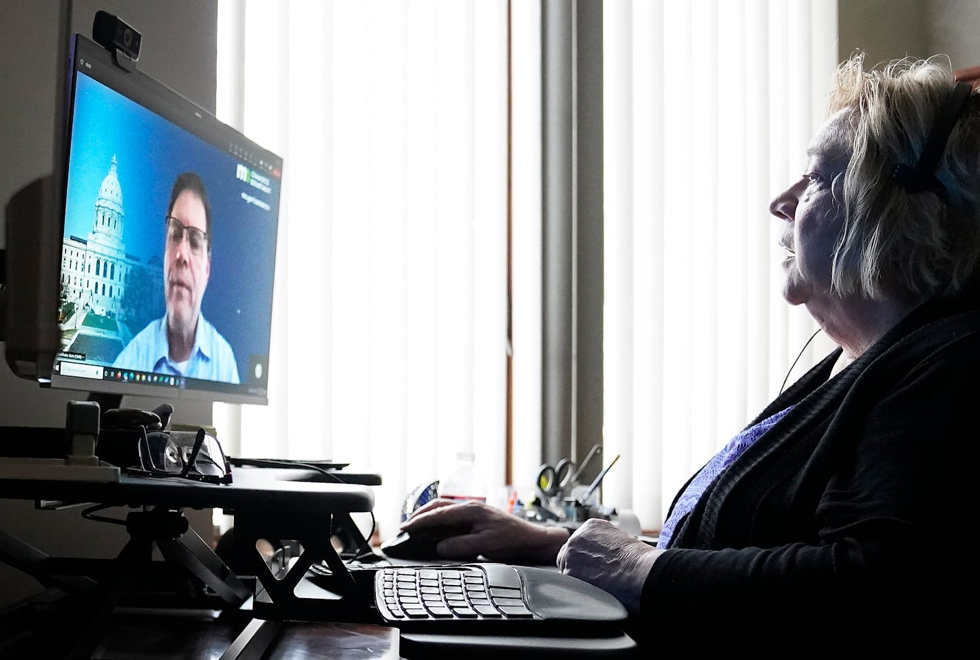 Anne Plante, Lake Elmo Bank vice president and retail banking manager, met virtually from her office with Martin Fleischhaker, an investigator with the Minnesota Department of Commerce, who specializes in investigating romance scams and other frauds perpetrated against adults, concerning some of those cases Thursday, Feb. 9, 2023 in Lake Elmo, Minn. ]