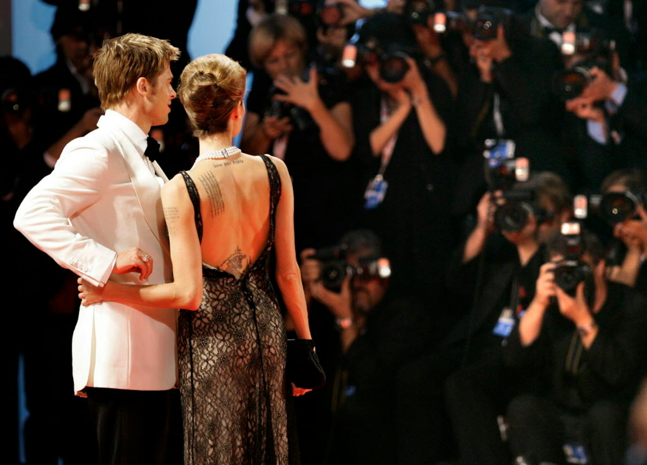 In 2007, Brad Pitt and Angelina Jolie are photographed as they arrive at the screening of the movie "The assassination of Jesse James by the coward Robert Ford" competing in the 64th edition of the Venice Film Festival in Venice, Italy.