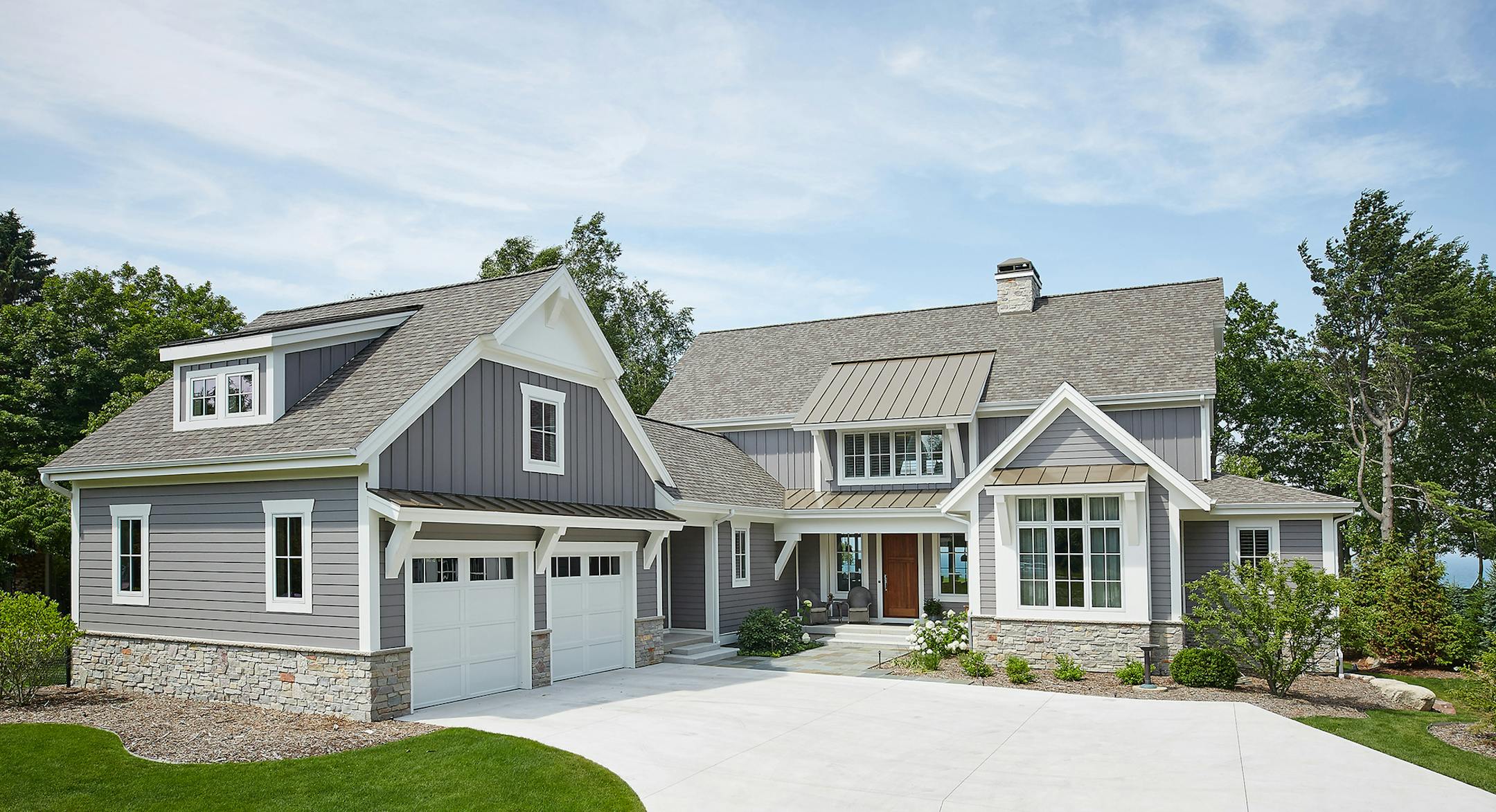 Home plan: Classic architectural accents give this modern barn-inspired design a historical look.