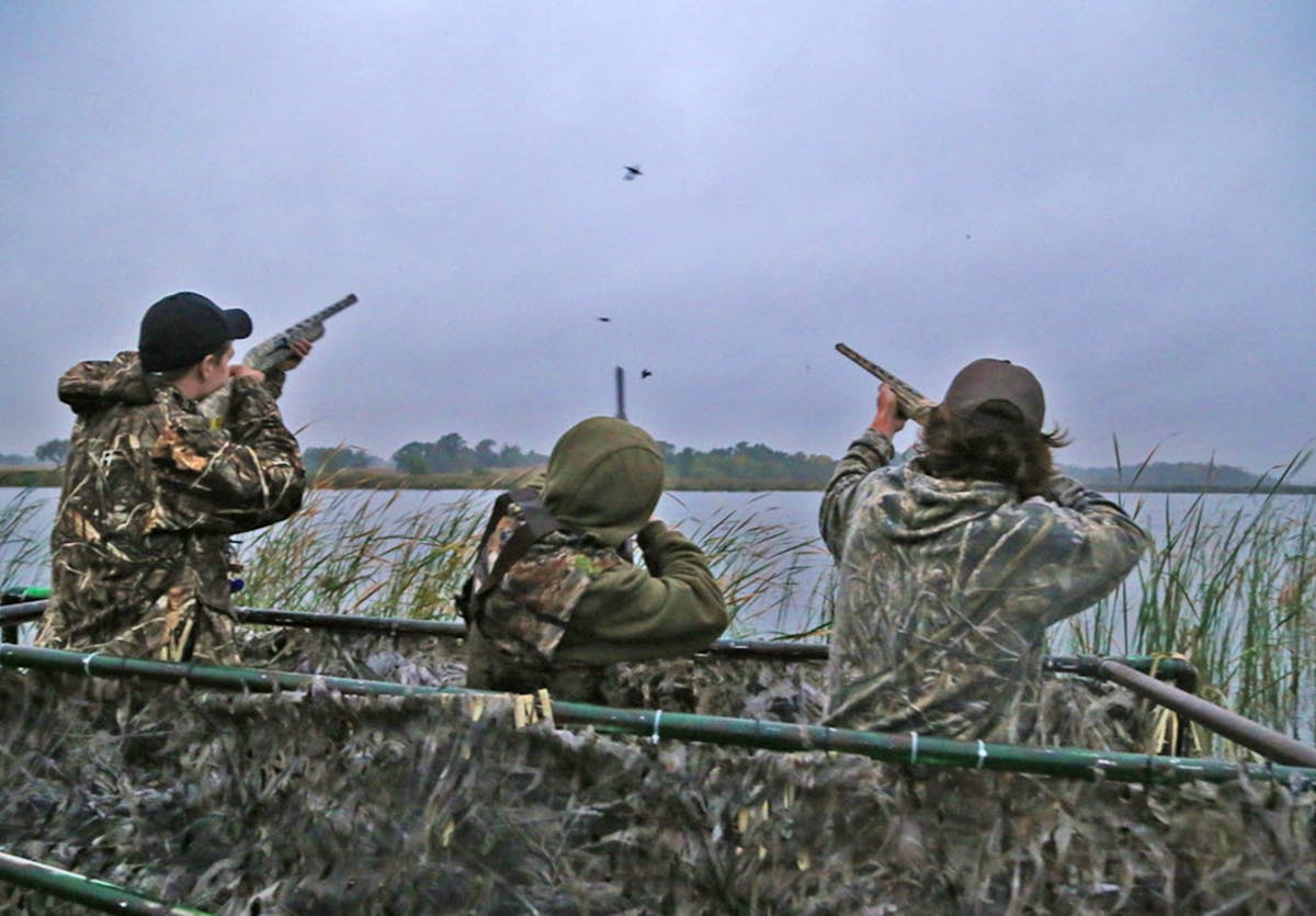 Trevor Unruh, left, Riley Mcalpine and Ryder Beckman drew down on a few blue-winged teal on the opener of the 2016 Minnesota duck season. The three we
