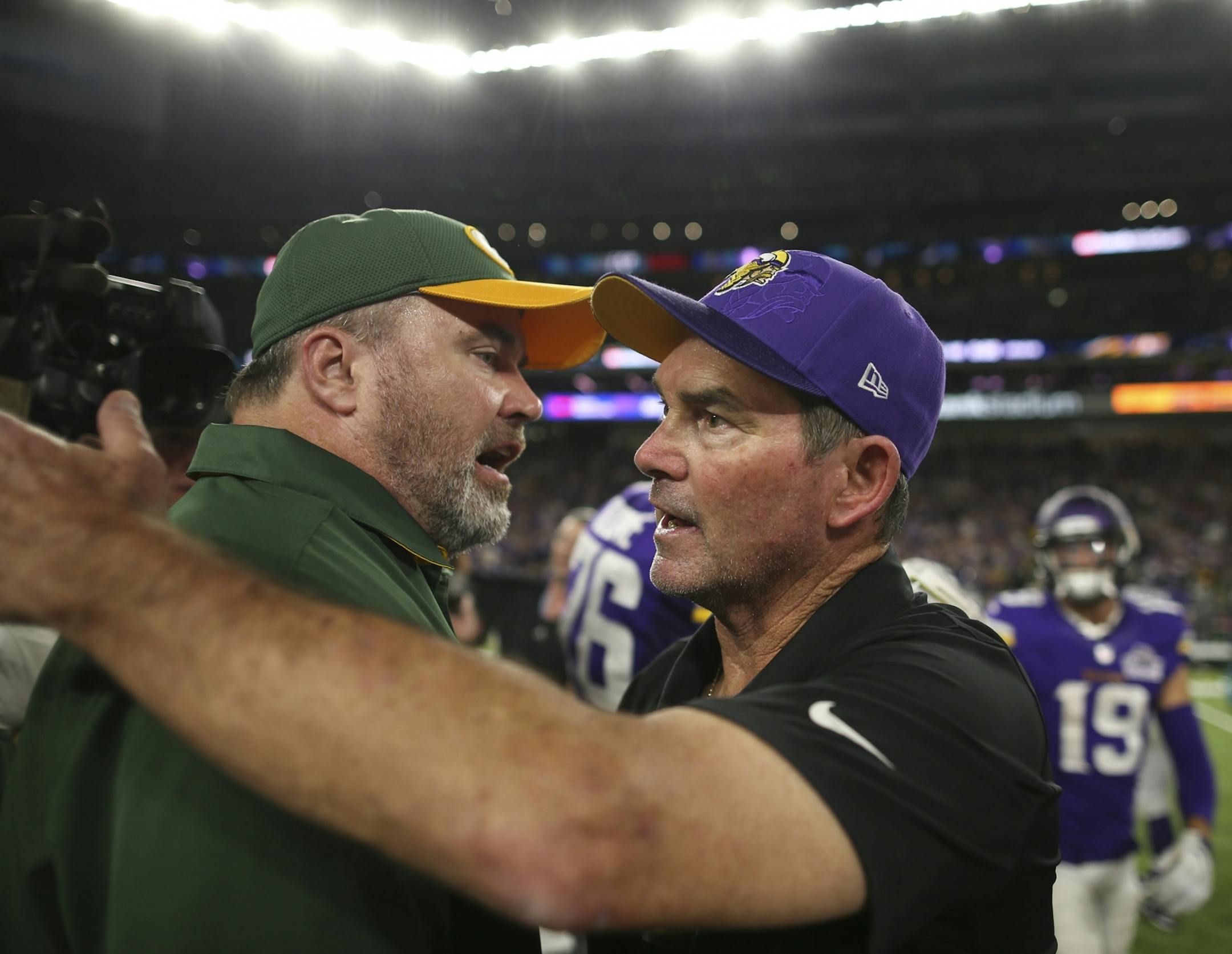 Vikings head coach Mike Zimmer was congratulated by Green Bay Packers head coach Mike McCarthy after his Vikings held off the Packers in the season opener Sunday night.