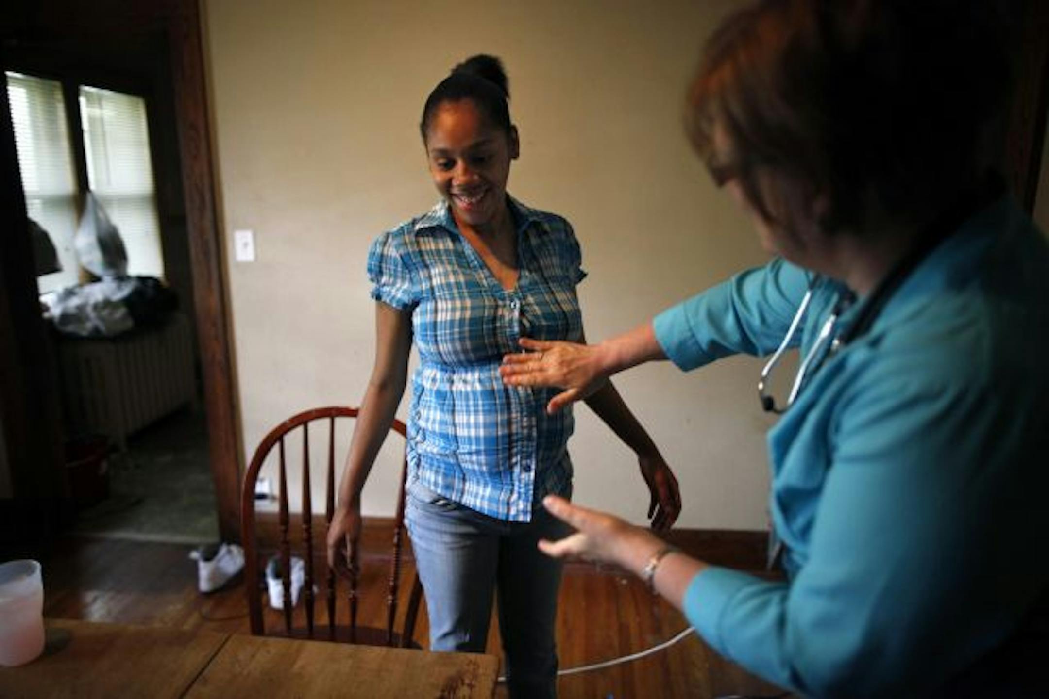 Camia Carruthers, 17, who is due to deliver in a week, met Wednesday with nurse Jeanne Kumlin, who discussed preparing for labor and newborns' feeding and sleep habits. Nurses with the Minnesota Visiting Nurse Agency are making checks with pregnant teens.
