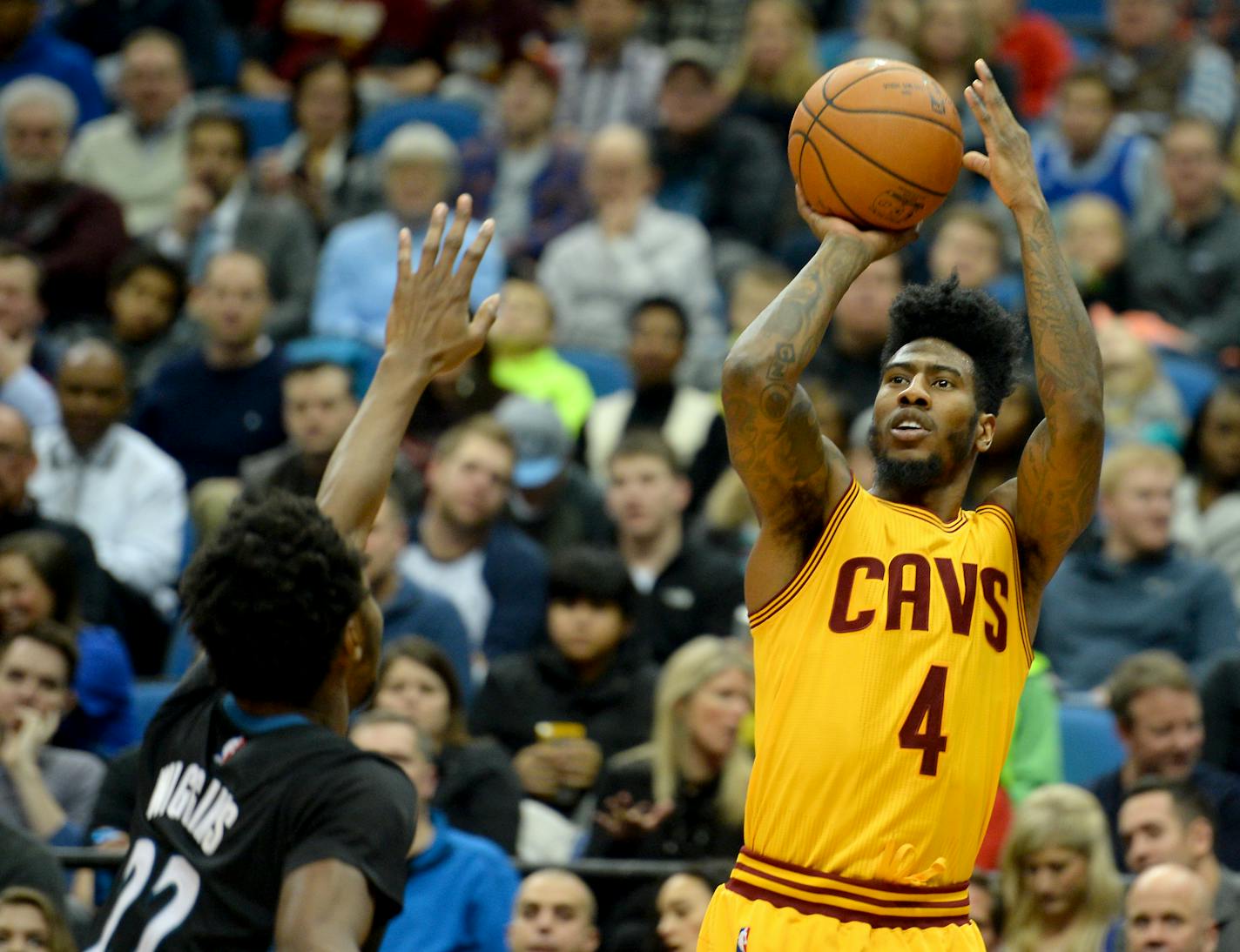 Cavaliers guard Iman Shumpert (4) hit a 3-point shot over Timberwolves guard Andrew Wiggins (22) in the third quarter Friday night.