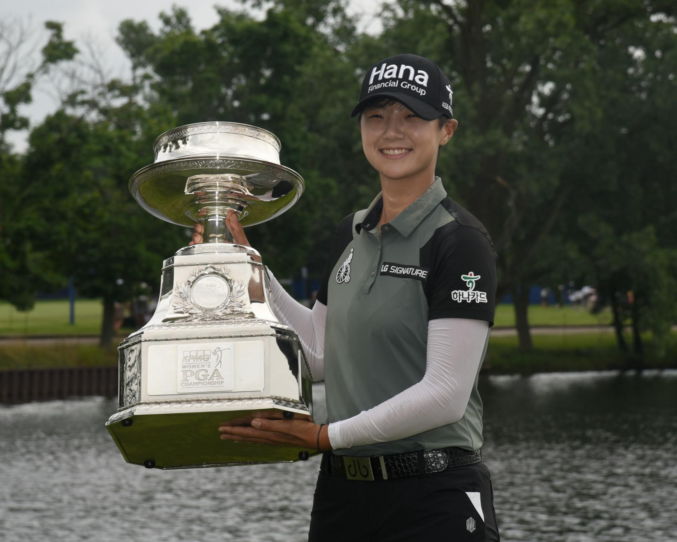 Sung Hyun Park, of South Korea, posses with the championship trophy after making a birdie on the second hole of a playoff on the 16th hole to win the KPMG Women's PGA Championship golf tournament at Kemper Lakes Golf Club in Kildeer, Ill., Sunday, July 1, 2018. (AP Photo/David Banks)