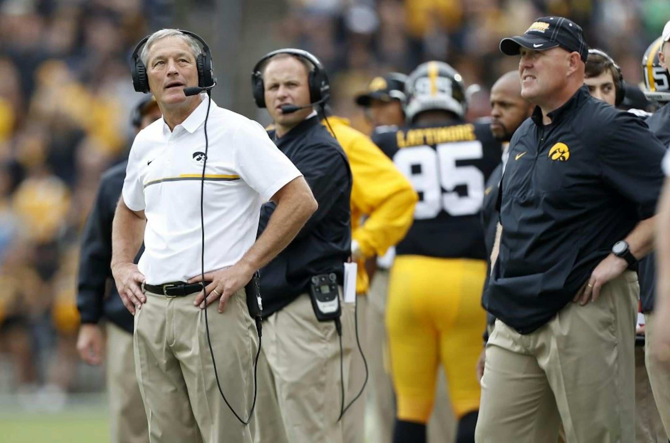 Iowa head coach Kirk Ferentz, left, checks a replay board during the first half of an NCAA college football game against Northwestern, Saturday, Oct. 1, 2016, in Iowa City, Iowa.