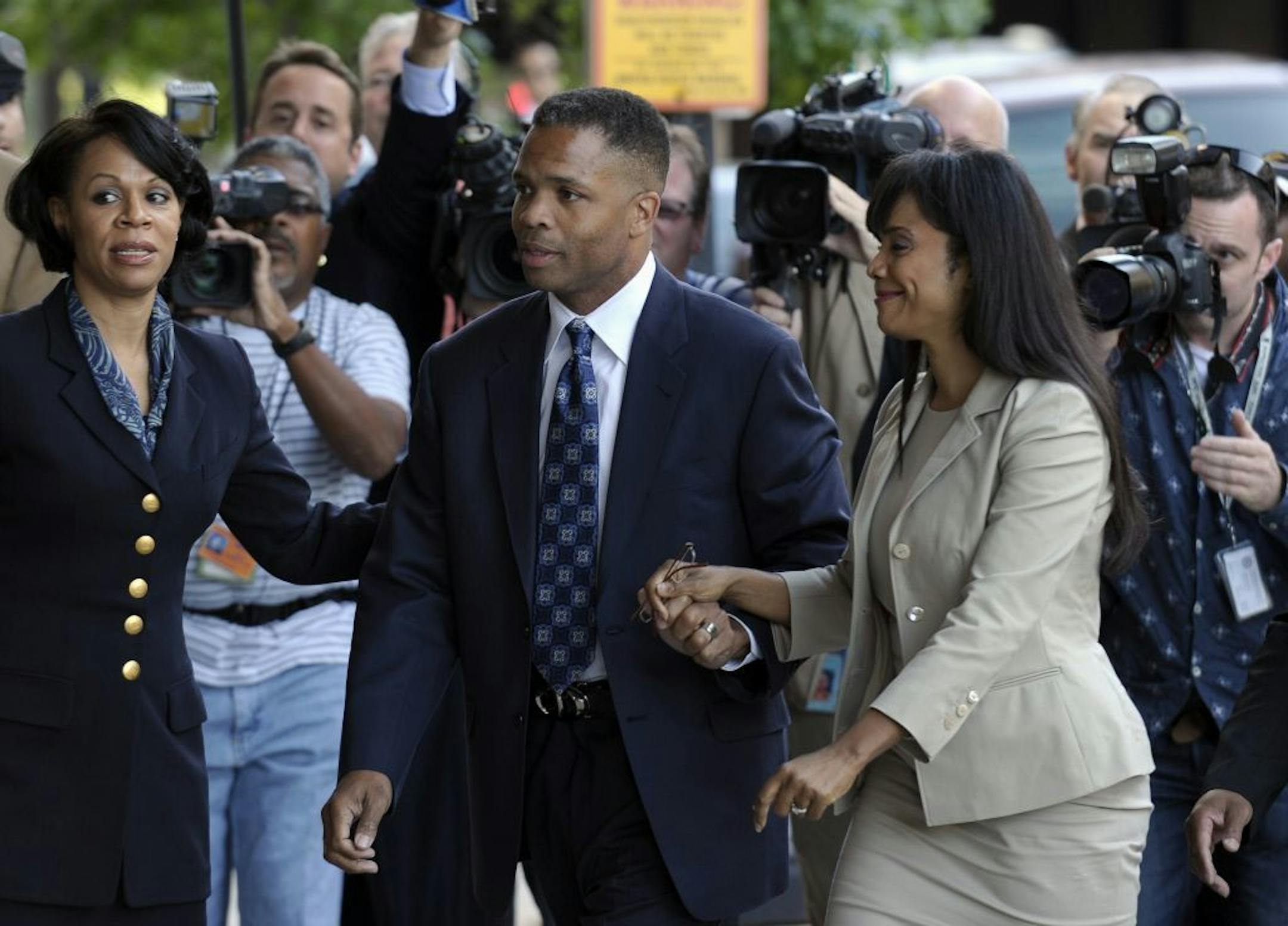 Former Illinois Rep. Jesse Jackson Jr. and his wife, Sandra, arrive at federal court in Washington, Wednesday, Aug. 14, 2013.