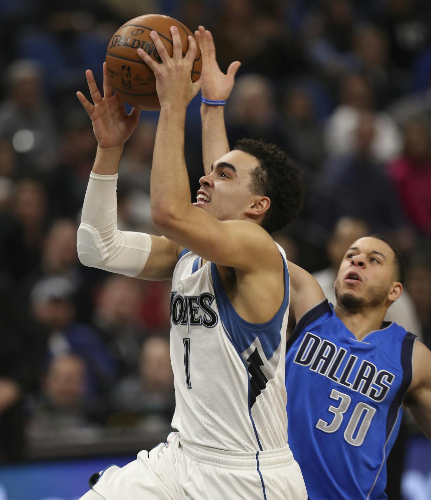 Minnesota Timberwolves guard Tyus Jones (1) drove to the net for a fourth quarter layup trailed by Dallas Mavericks guard Seth Curry (30). ] JEFF WHEELER &#xef; jeff.wheeler@startribune.com The Minnesota Timberwolves beat the Dallas Mavericks 101-92 in an NBA basketball game Monday night, January 9, 2017 at Target Center in Minneapolis.