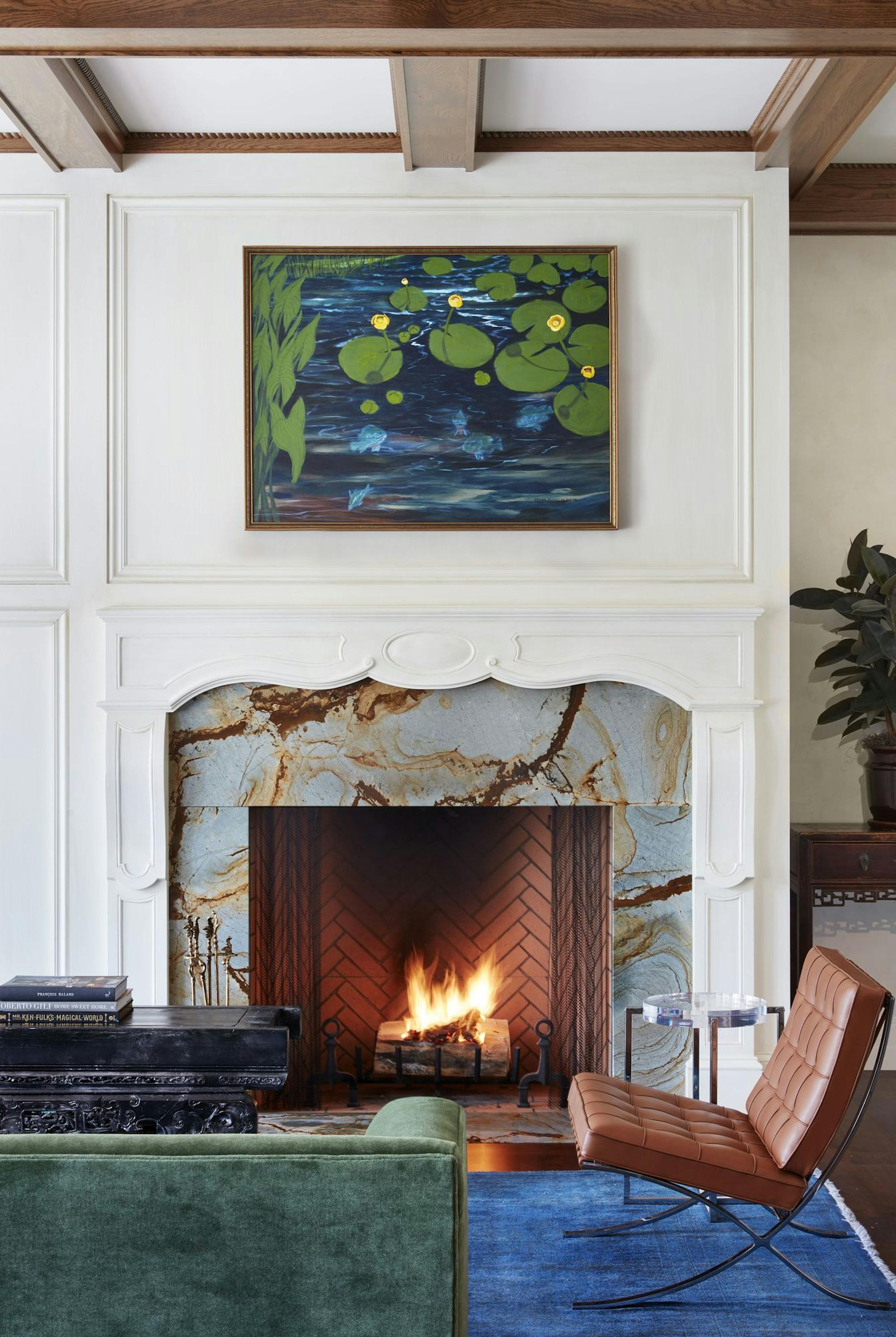 Artwork and rich colors personalize a living area designed by Sandy LaMendola of Twist Design.