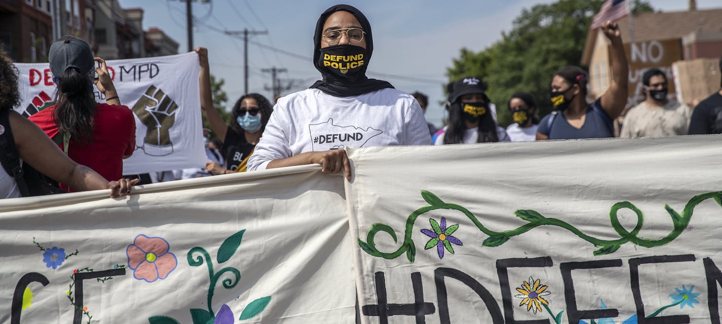 Protestors walk in a Defund the Police march Saturday, June 6, 2020, in Minneapolis. Across the country, calls are mounting from some activists and elected officials to defund, downsize or abolish police departments. (Victor J. Blue/The New York Times)