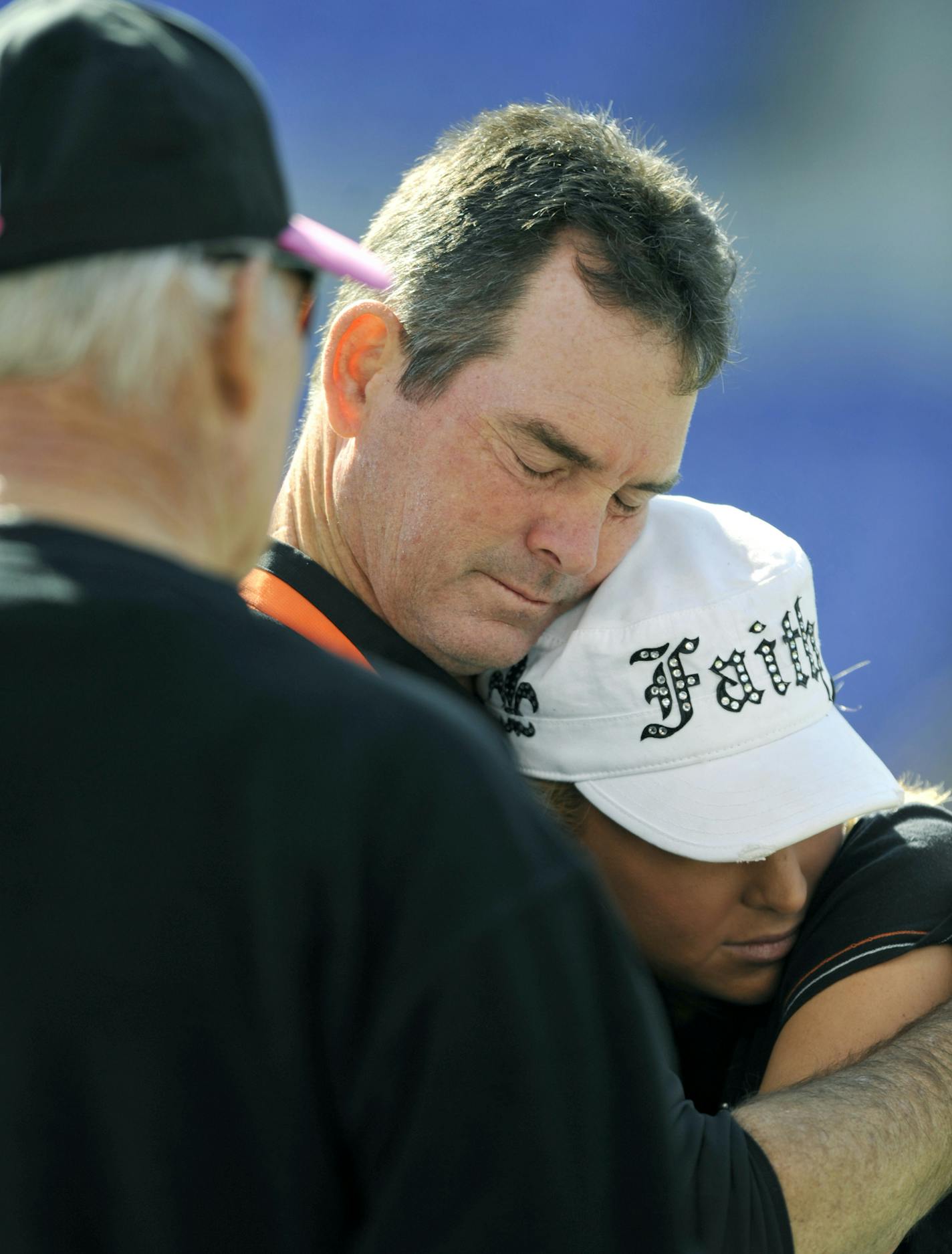 Cincinnati Bengals defensive coordinator Mike Zimmer hugs his daughter Corri before the start of an NFL football game against the Cincinnati Bengals, Sunday, Oct. 11, 2009, in Baltimore. Vikki Zimmer died Thursday night in Cincinnati. The Zimmers were married for 27 years. (AP Photo/Gail Burton) ORG XMIT: BAF201