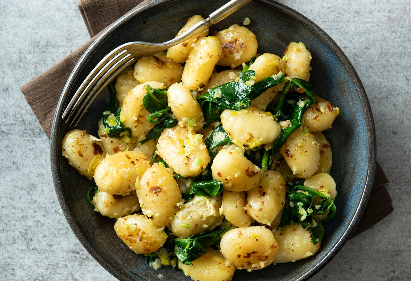 Golden Gnocchi with Fresh Spinach. Credit: Mette Nielsen, Special to the Star Tribune