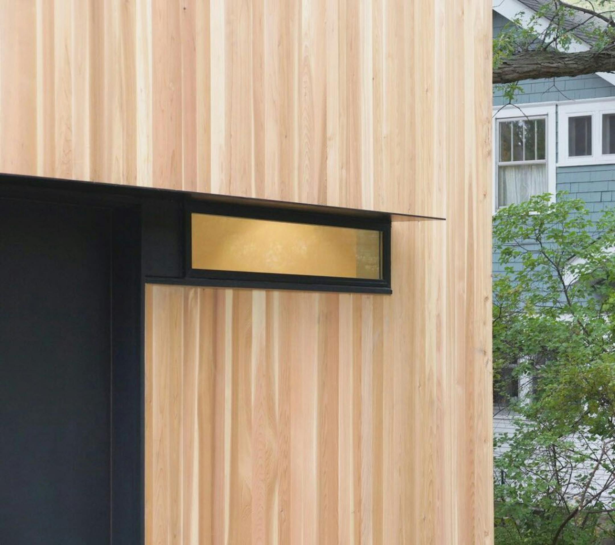 The exterior is clad in unfinished cedar, to weather naturally.