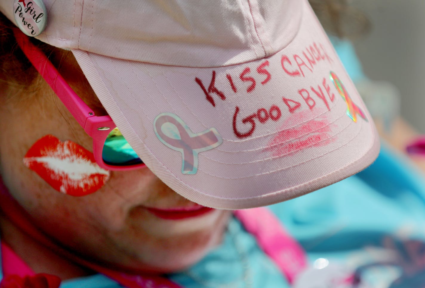 Walkers participating in the Susan G Komen 3-Day approach pit stop 3 near Brackett Recreation Center Friday, Aug. 16, 2019, in Minneapolis, MN. Here, volunteer Cathy Cooper, a cancer survivor, wore this message on her hat, sealed with a kiss, as she welcomed walkers to the pit stop.] DAVID JOLES &#x2022; david.joles@startribune.com The Susan G Komen 3-Day kicks off Friday in downtown Minneapolis.