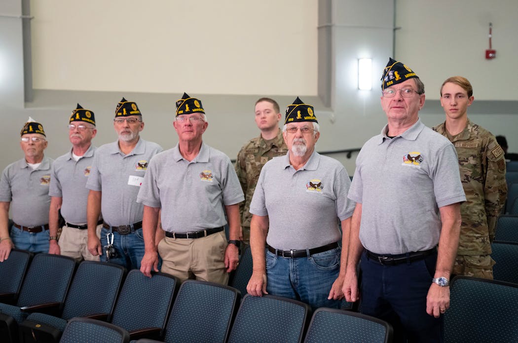 Members of American Legion Post 555 and active military alumni from Edison High stood to be recognized at Friday's ceremony.