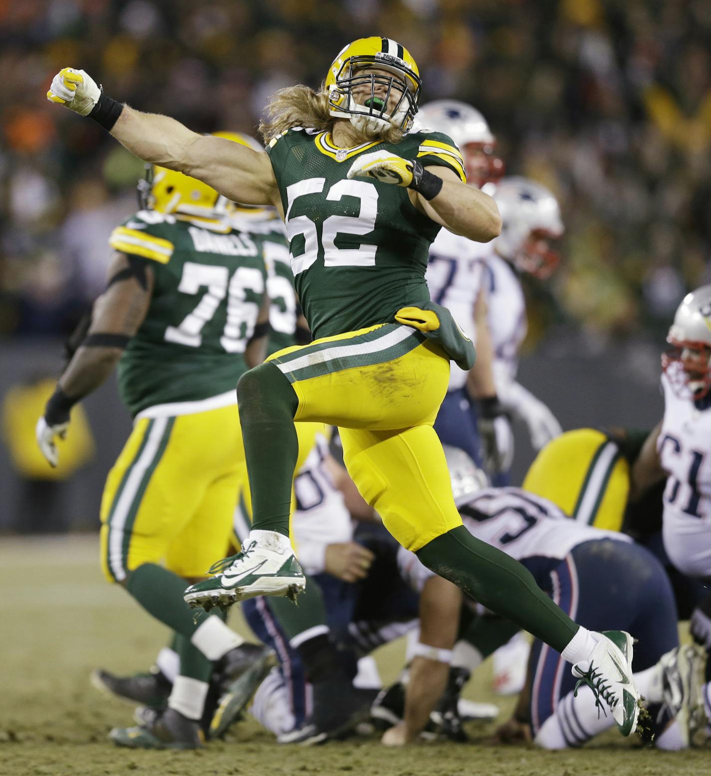 Green Bay Packers' Clay Matthews celebrates after the New England Patriots missed a field goal attempt during the second half of an NFL football game Sunday, Nov. 30, 2014, in Green Bay, Wis. (AP Photo/Tom Lynn) ORG XMIT: WIMG129