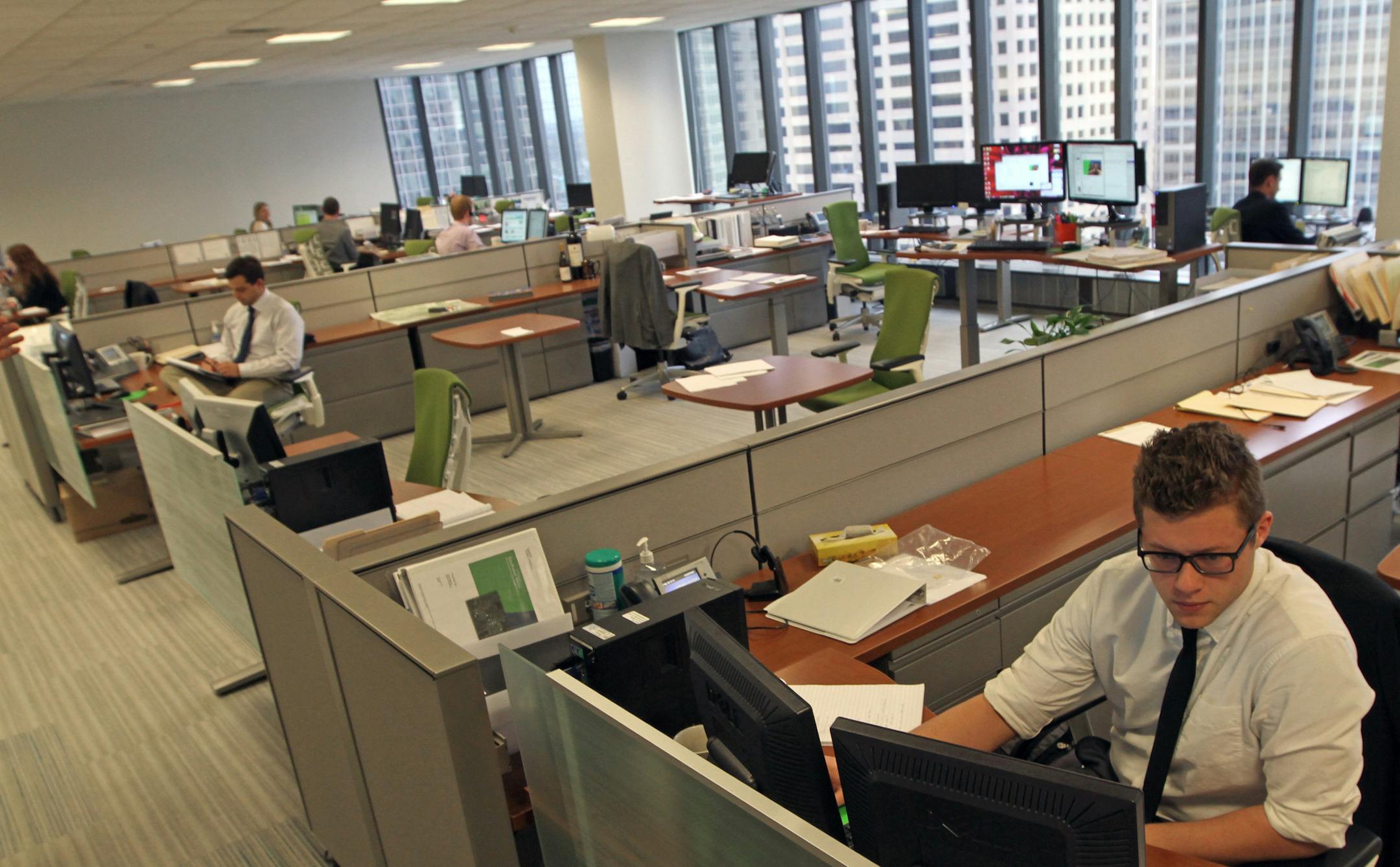 Real estate firm Cassidy-Turley has recently moved its offices into the IDS Center. The design of the firm's office has Millenials in mind -- less cubicle and more confabbing. Photographed on 4/11/13.] Bruce Bisping/Star Tribune bbisping@startribune.com Dennis L. Panzer/source.