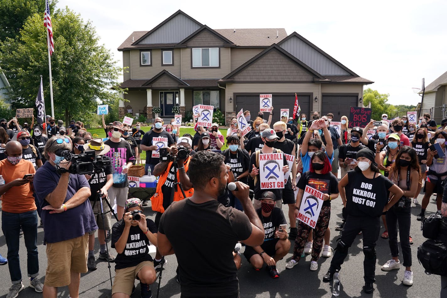 Toussaint Morrison spoke to more than 100 Black Lives Matter protesters as they rallied outside the home of Minneapolis Police Federation president Bob Kroll and his wife WCCO reporter Liz Collin in a continued effort to get them both fired from their jobs Saturday. ] ANTHONY SOUFFLE • anthony.souffle@startribune.com More than 100 Black Lives Matter protesters gathered outside Minneapolis Police Federation president Bob Kroll and his wife WCCO reporter Liz Collin's house in a continued effort to