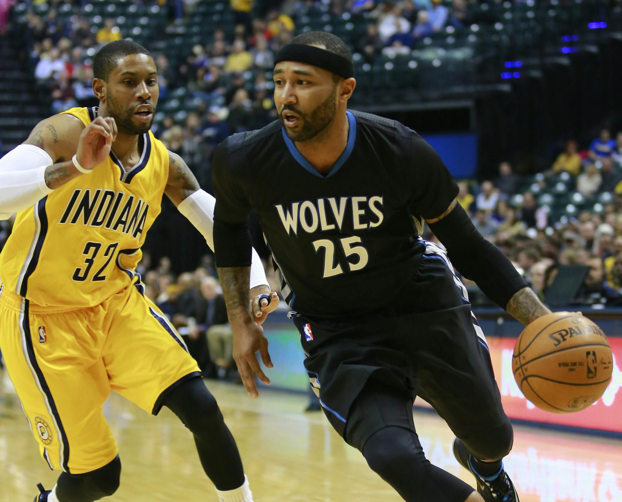 Minnesota Timberwolves guard Mo Williams (25) dribbles the basketball guarded by Indiana Pacers guard C.J. Watson in the first half of an NBA basketball game in Indianapolis, Tuesday, Jan. 13, 2015. (AP Photo/R Brent Smith) ORG XMIT: MIN2015011320141828 ORG XMIT: MIN1501132016282441