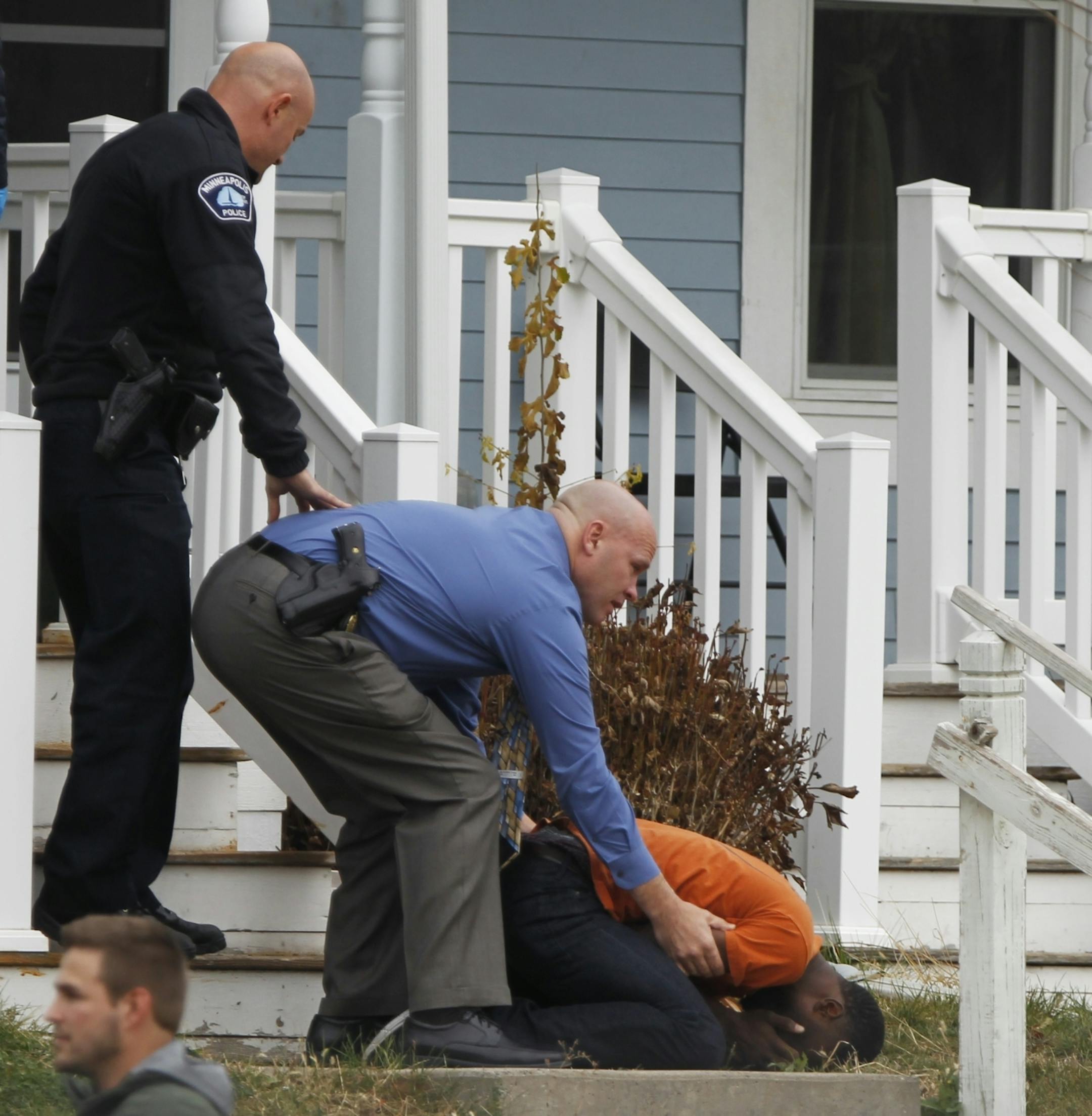 In North Minneapolis, police officers and crime lab personnel restrained and comforted relatives who tried to enter rhe crime scene .