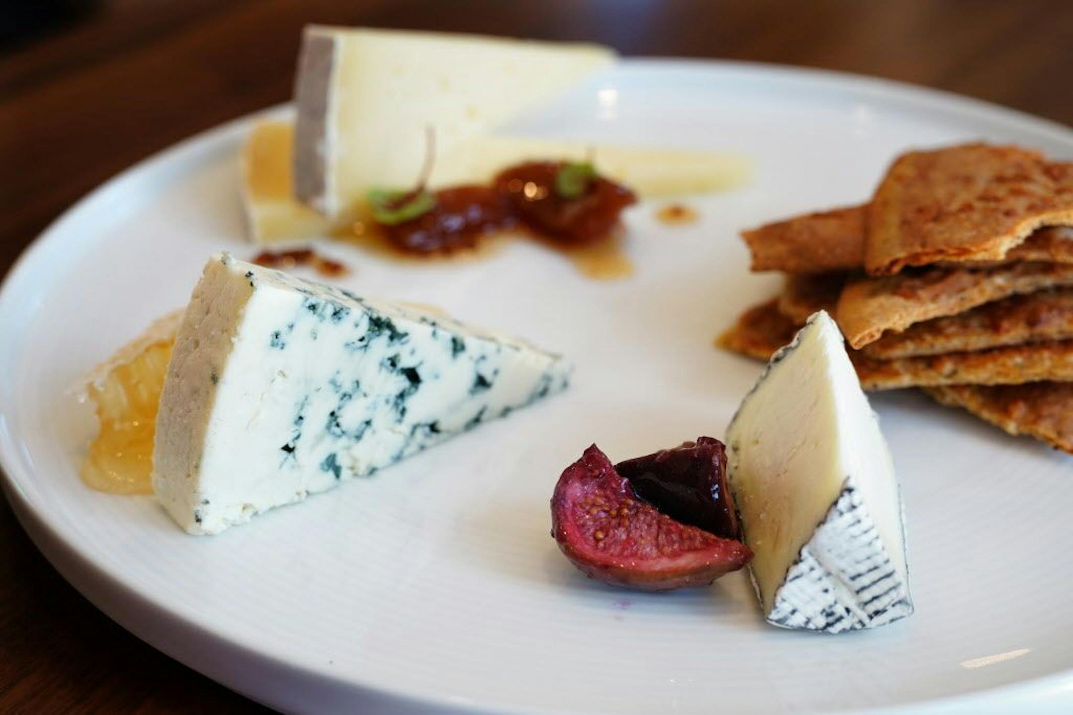 The cheese plate has Northern Lights Blue Cheese, Dirt Lover from Missouri, and Quattro Latti from Italy.