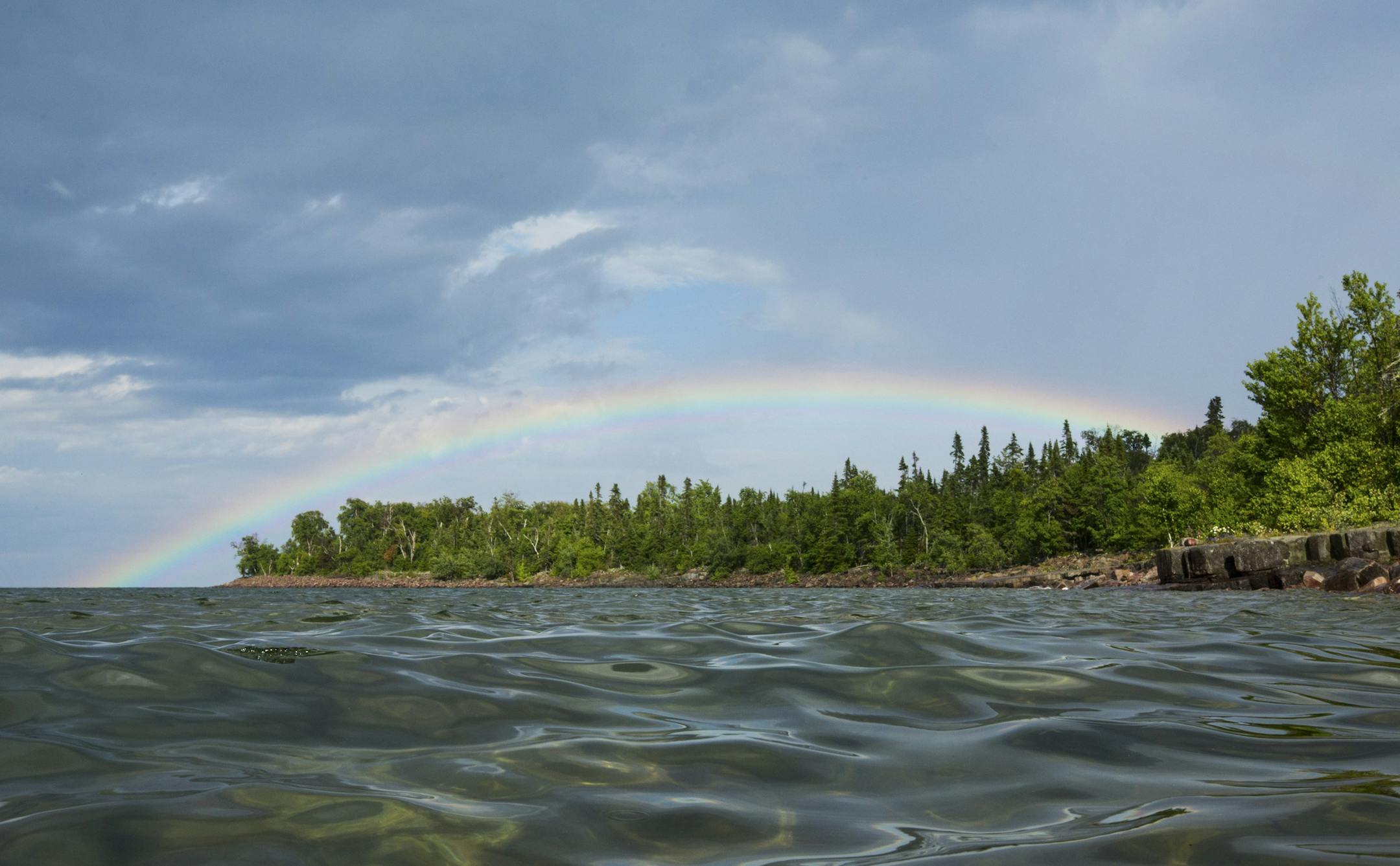 A rainbow over Rabbit Island as seen from Lake Superior in Michigan, July 25, 2013. Rob Gorski became an unlikely member on the list of people who own their own island three years ago, when he bought a 91-acre island off the Keweenaw Peninsula of Michigan after spotting it on Craigslist. (Tony Cenicola/The New York Times) ORG XMIT: MIN2013081012482602