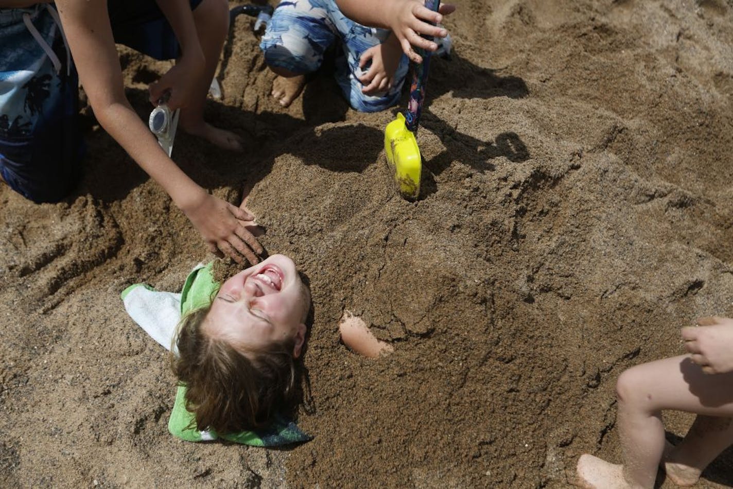 At the Lake Elmo Park Preserve swimming beach, hundreds of people enjoyed the weather on Memorial day including Mackenzie Knauff,11, of St. Paul Park .