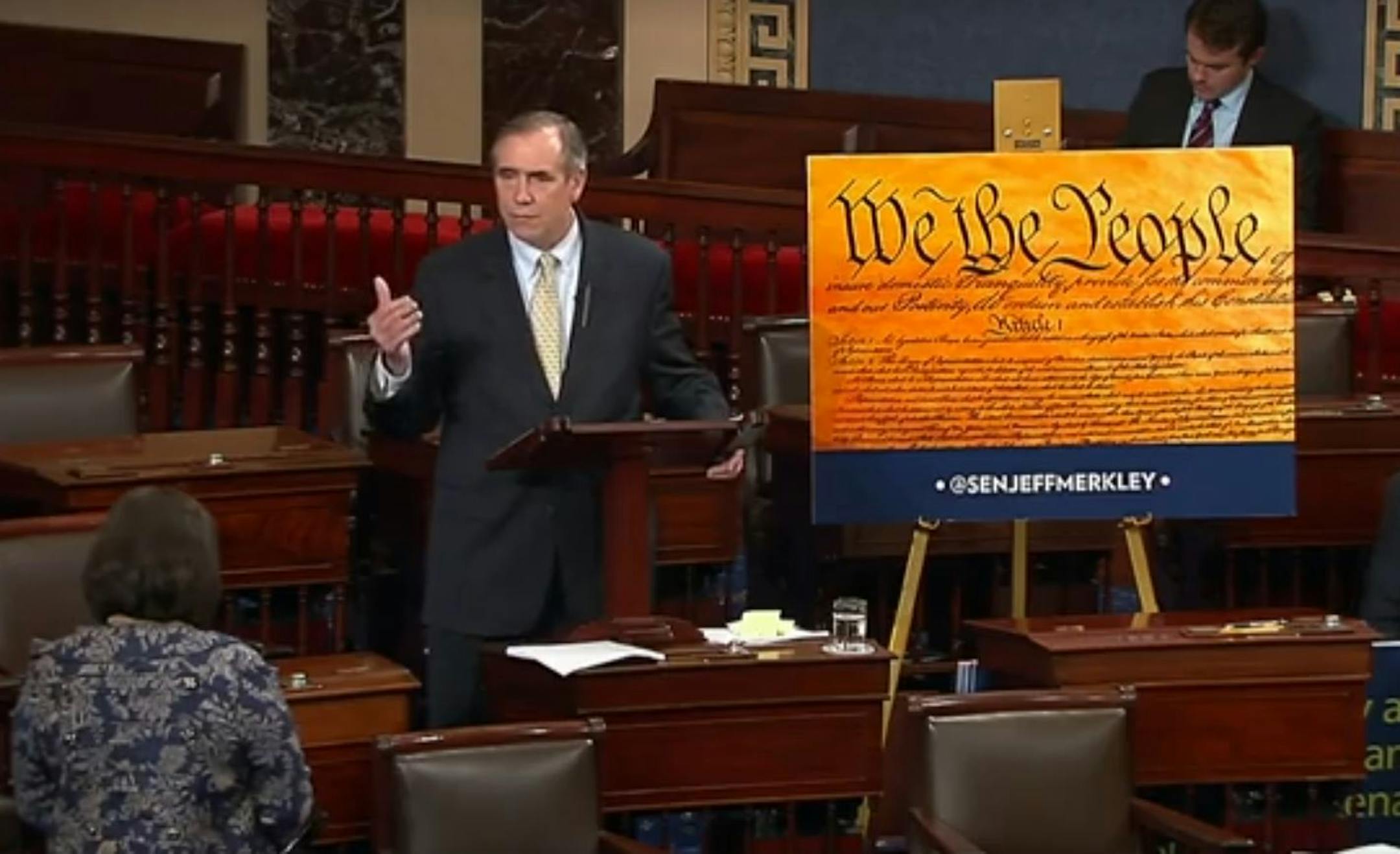 Sen. Jeff Merkley, D-Ore., streams his speech live on Facebook from the Senate floor.