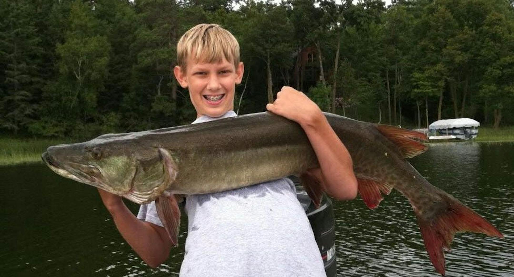 Aaron Johnson, 13, of Shorewood. pulled this 48-inch muskie from a lake near Longville.