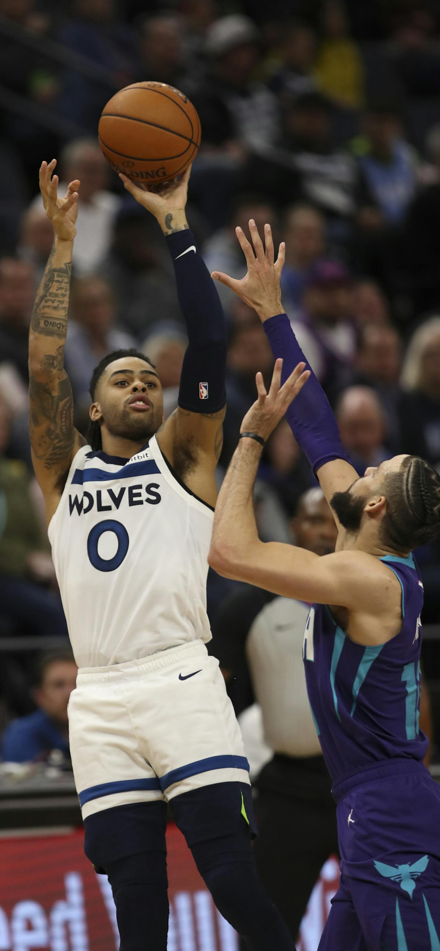 Minnesota Timberwolves guard D'Angelo Russell (0) hit a fourth quarter shotwhile defended by Charlotte Hornets forward Caleb Martin (10). Russell finished with 26 points. ] JEFF WHEELER &#x2022; Jeff.Wheeler@startribune.com The Minnesota Timberwolves lost to the Charlotte Hornets 115-108 in an NBA basketball game Wednesday night, February 12, 2020 at Target Center in Minneapolis.