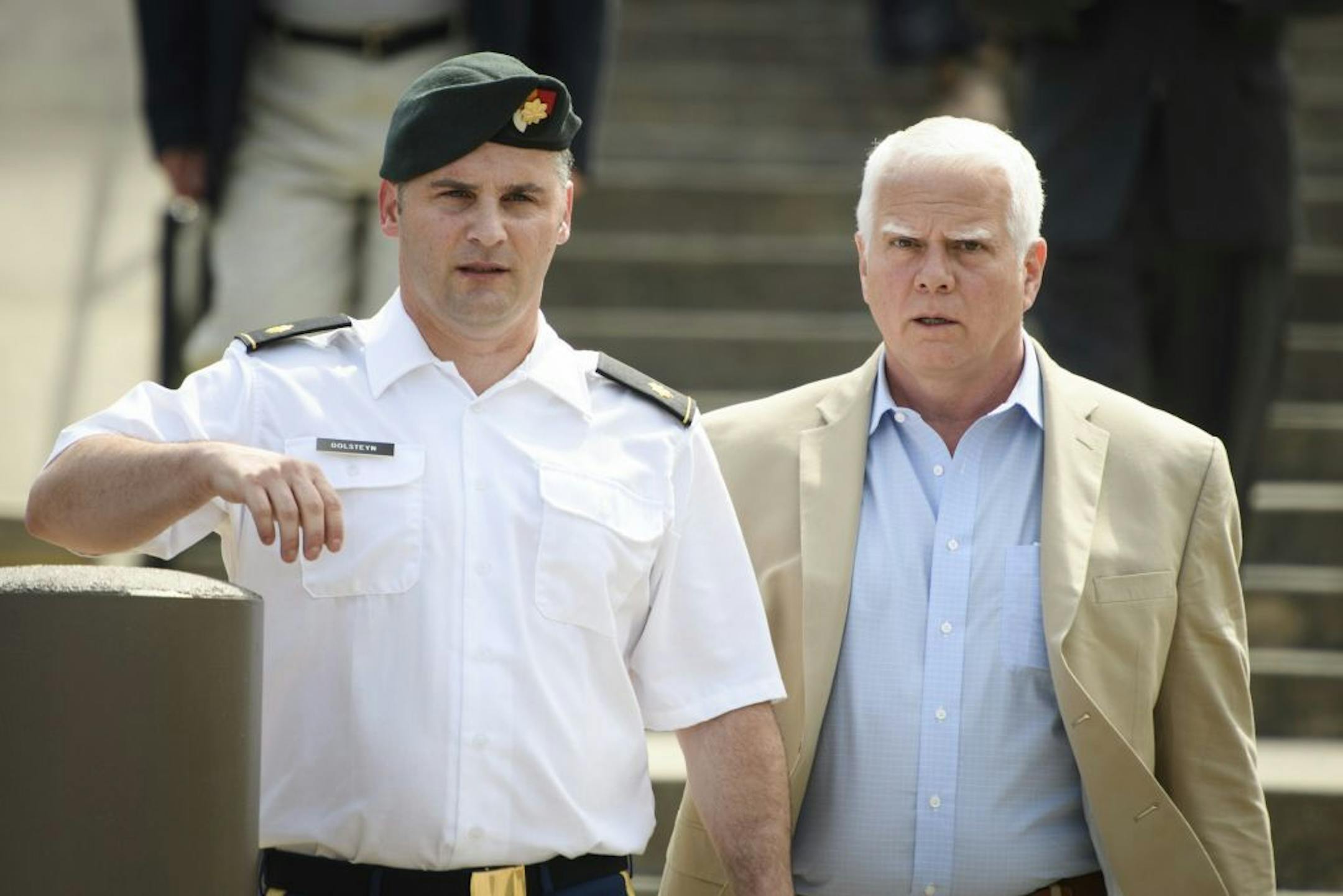 Maj. Mathew Golsteyn, a former Army Special Forces soldier, left the Fort Bragg courtroom facility on June 27 with his civilian lawyer, Phillip Stackhouse, right, after an arraignment hearing. President Donald Trump has pardoned a former U.S. Army commando set to stand trial next year in the killing of a suspected Afghan bomb-maker and for a former Army lieutenant who had been convicted of murder after he ordered his men to fire upon three Afghans, killing two, the White House announced late Fri