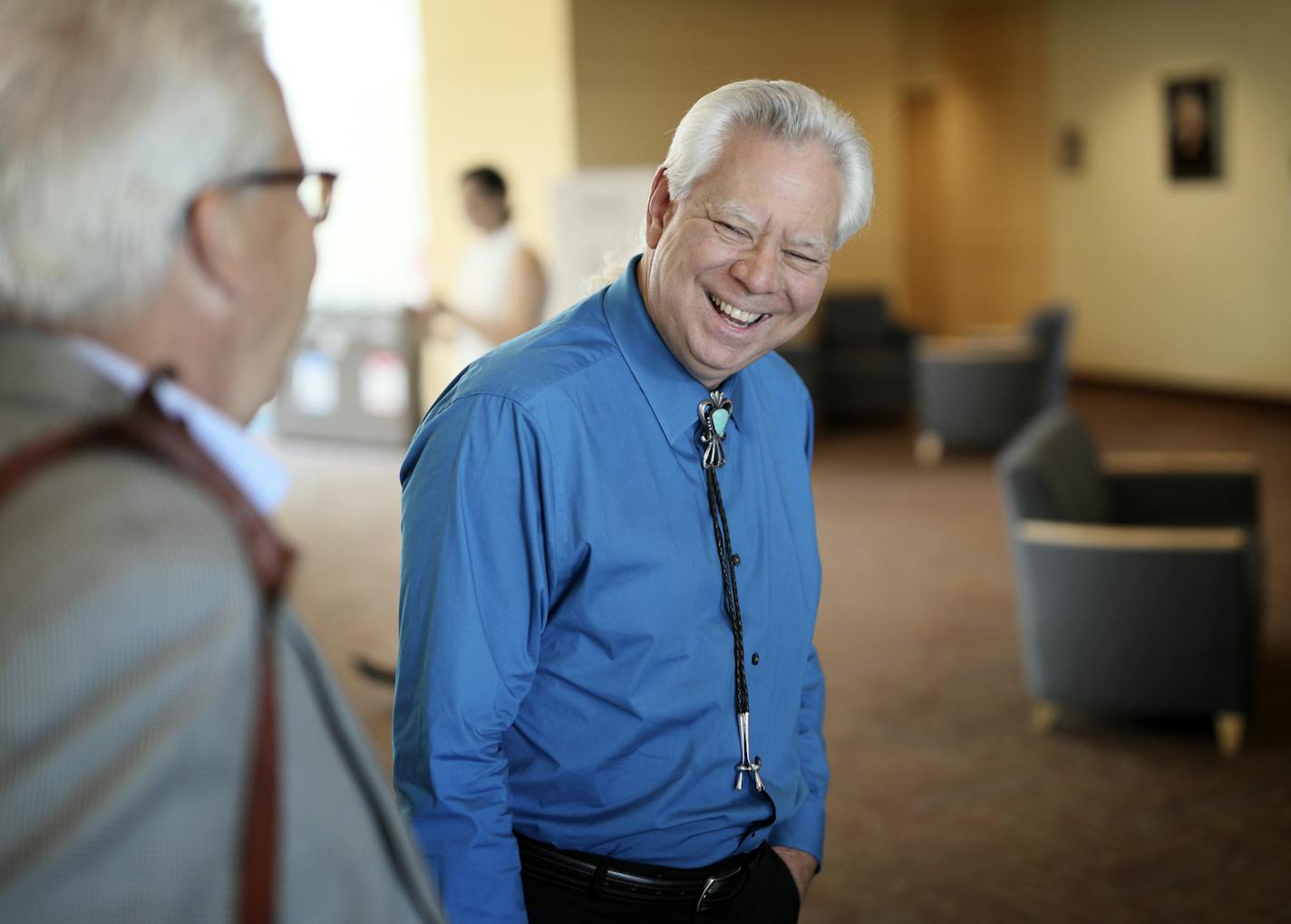 Eric Jolly talks with community members before a meting of the college savings task force started by St. Paul Mayor Carter
BRIAN PETERSON &#x2022; brian.peterson@startribune.com
St. Paul, MN 08/08/2018