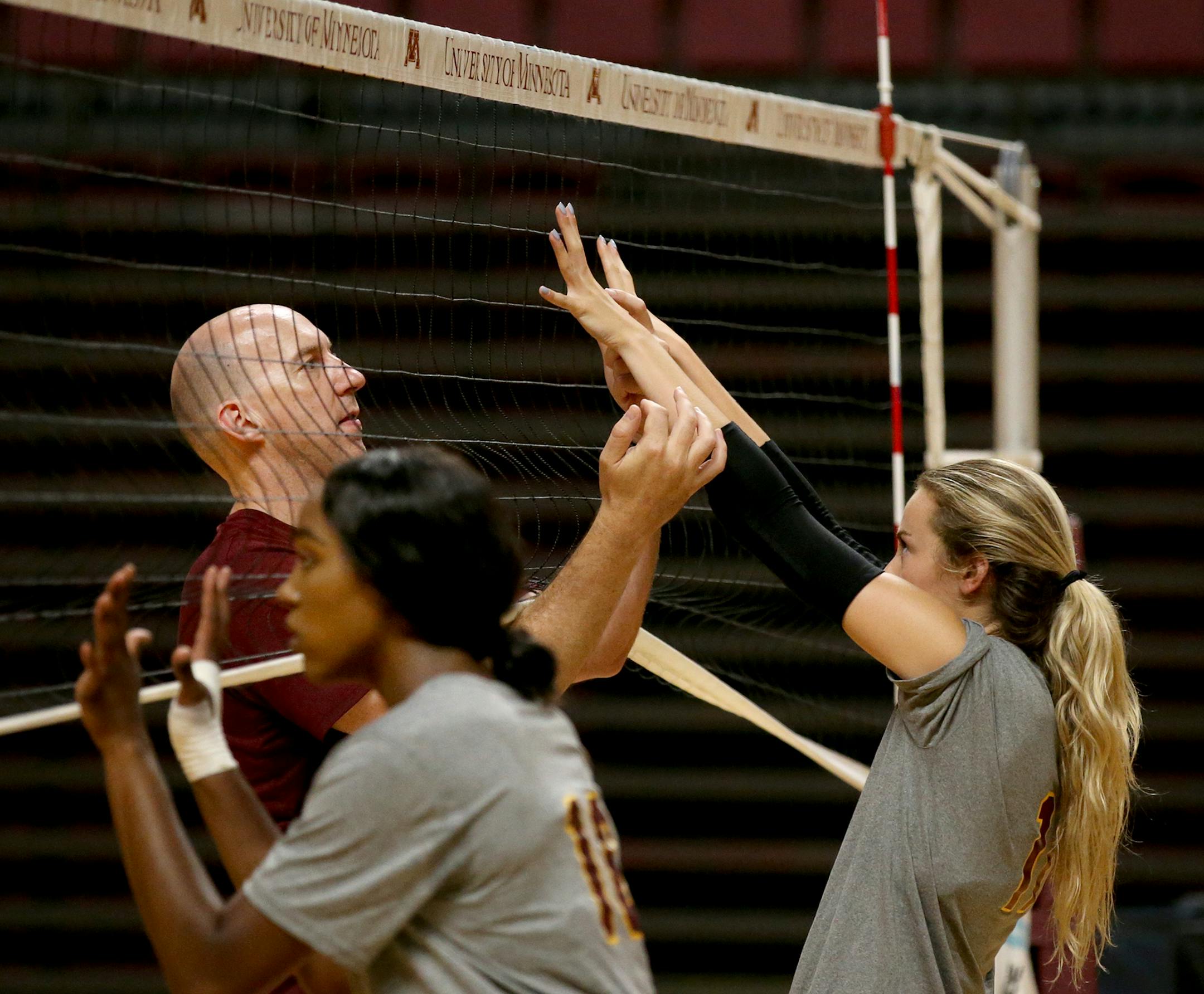 The expectations are high for University of Minnesota womenís volleyball coach Hugh McCutcheon and his talented, young team that went deep into the NCAA tournament last year and will hosting the 2018 Division I Women's Volleyball Championship in December. Here, McCutcheon is seen working with Samantha Seliger-Swenson during practice Tuesday, Aug. 14, 2018, at Maturi Pavilion on the University of Minnesota campus in Minneapolis, MN.] DAVID JOLES ï david.joles@startribune.com University