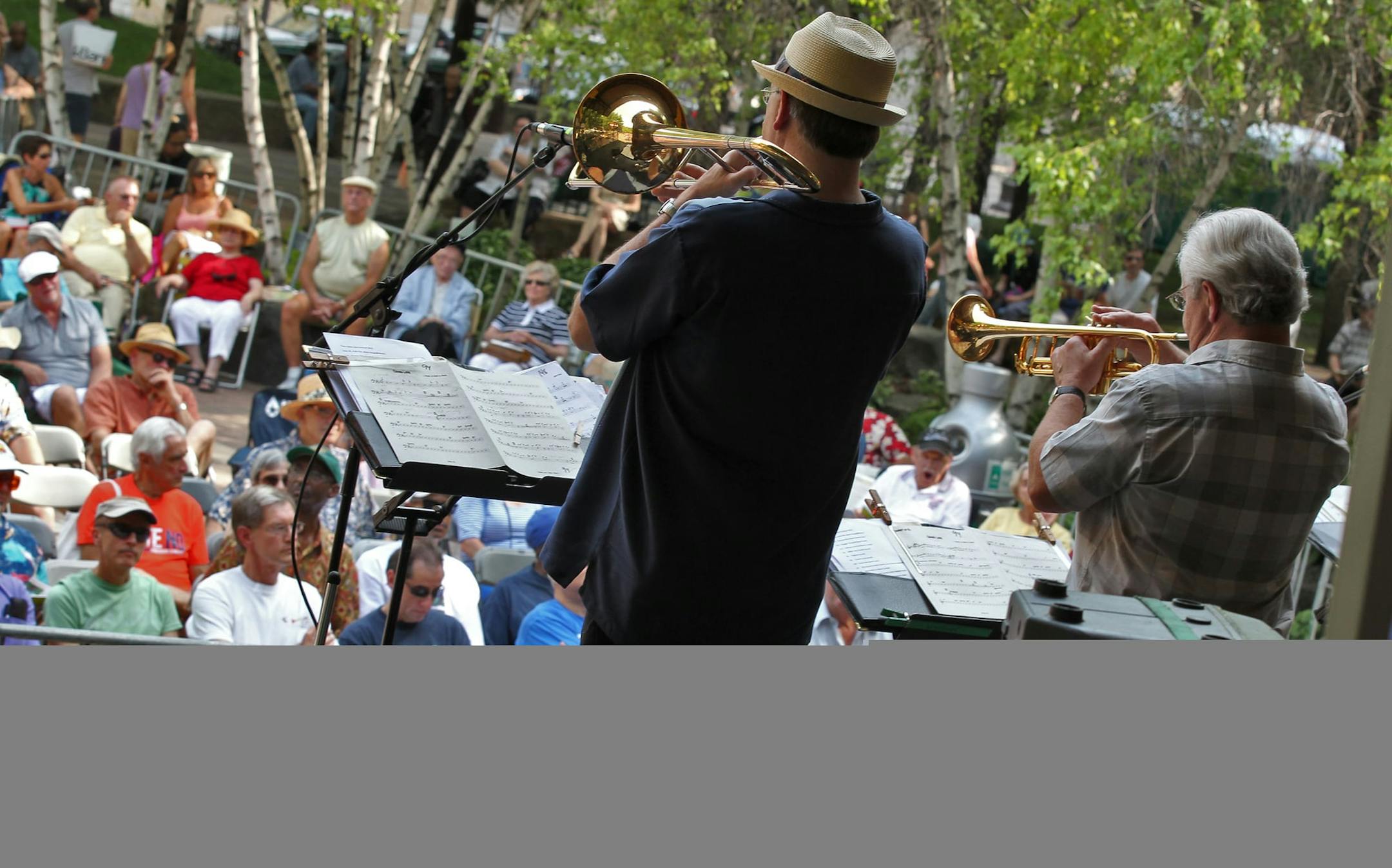 The annual Twin Cities Jazz Festival is under way at St. Paul's Mears Park, continuing Saturday. The Twin Cities Seven jazz band played to an audience seated in the park. (MARLIN LEVISON/STARTRIBUNE(mlevison@startribune.com (cq ) ORG XMIT: MIN2014050809410015