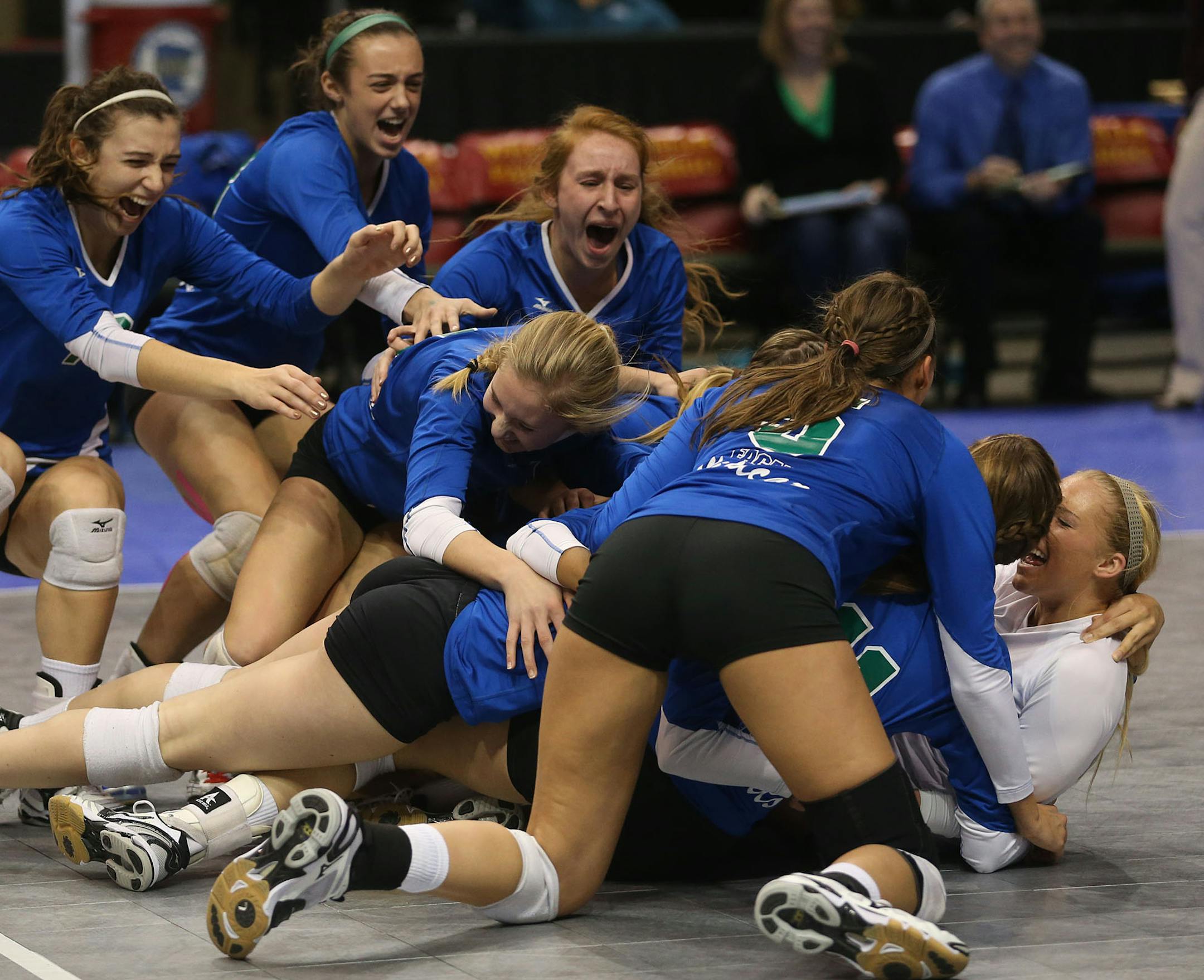 Eagan team celebrated after winning the state championship Class 3A finals at the Xcel Energy Center in St. Paul, Min., Saturday, November 9, 2013. Eagan won over Delano 3-2. ] (KYNDELL HARKNESS/STAR TRIBUNE) kyndell.harkness@startribune.com