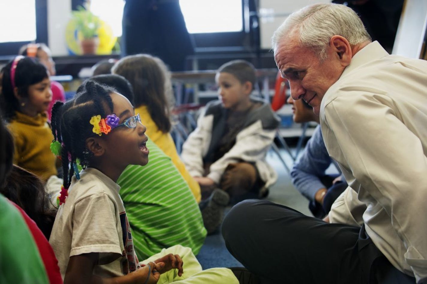 Second-grader Joy Coleman talked to Gov. Mark Dayton about her pet fish after the governor read a Dr. Seuss book about pets to her class in 2011. Increased spending on E-12 education is part of the legacy of Dayton's eight years as governor.