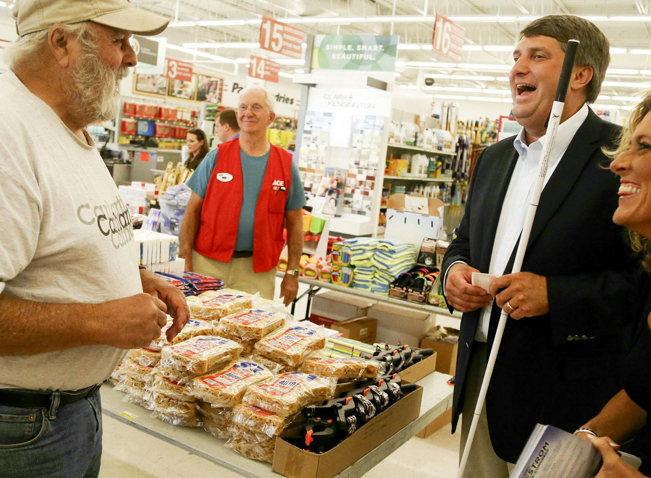 Congressional candidate Torrey Westrom, a Minnesota State Senate veteran who happens to be blind, campaigned along Main Street in Alexandria Wednesday, July 30, 2014. Here, Westrom and campaign manager Liz Gorham chat with supporter Peter Boerner at the Ace Hardware store downtown.] (DAVID JOLES/STARTRIBUNE) djoles@startribune Congressional candidate Torrey Westrom, a Minnesota State Senate veteran who happens to be blind, campaigned along Main Street in Alexandria recently. Westrom is challengi