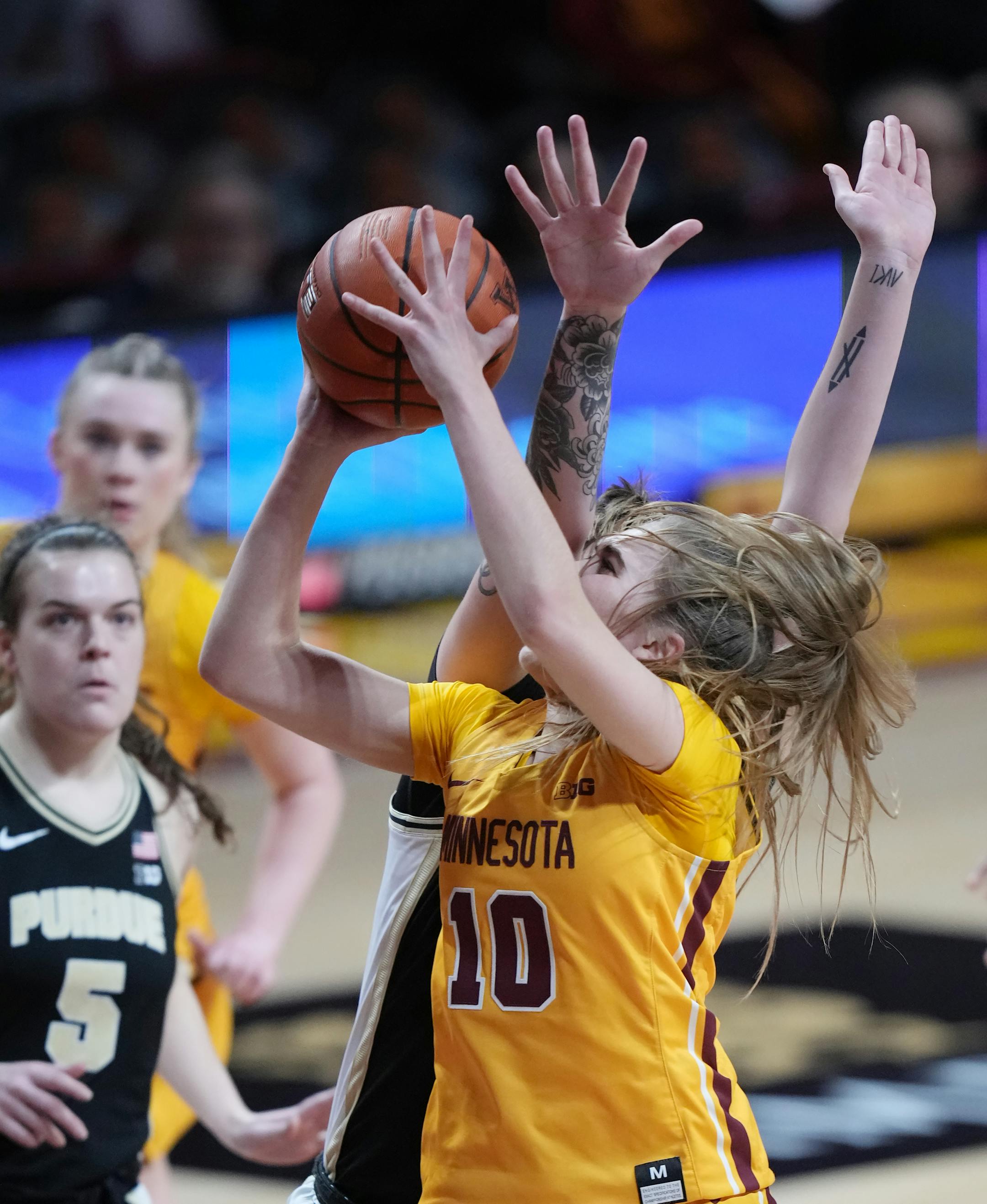 Minnesota Gophers' Mara Braun (10) attempts a layup.