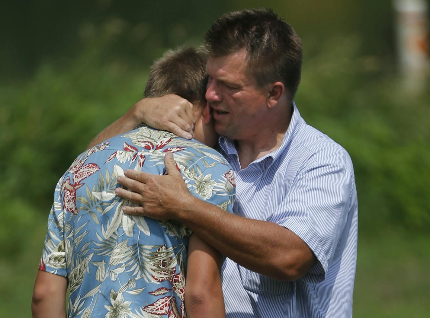 A member of the South High School football player drowned Wednesday in Lake Nokomis in Minneapolis. Head coach Lenny Sedlock comforted one of his players at the scene.