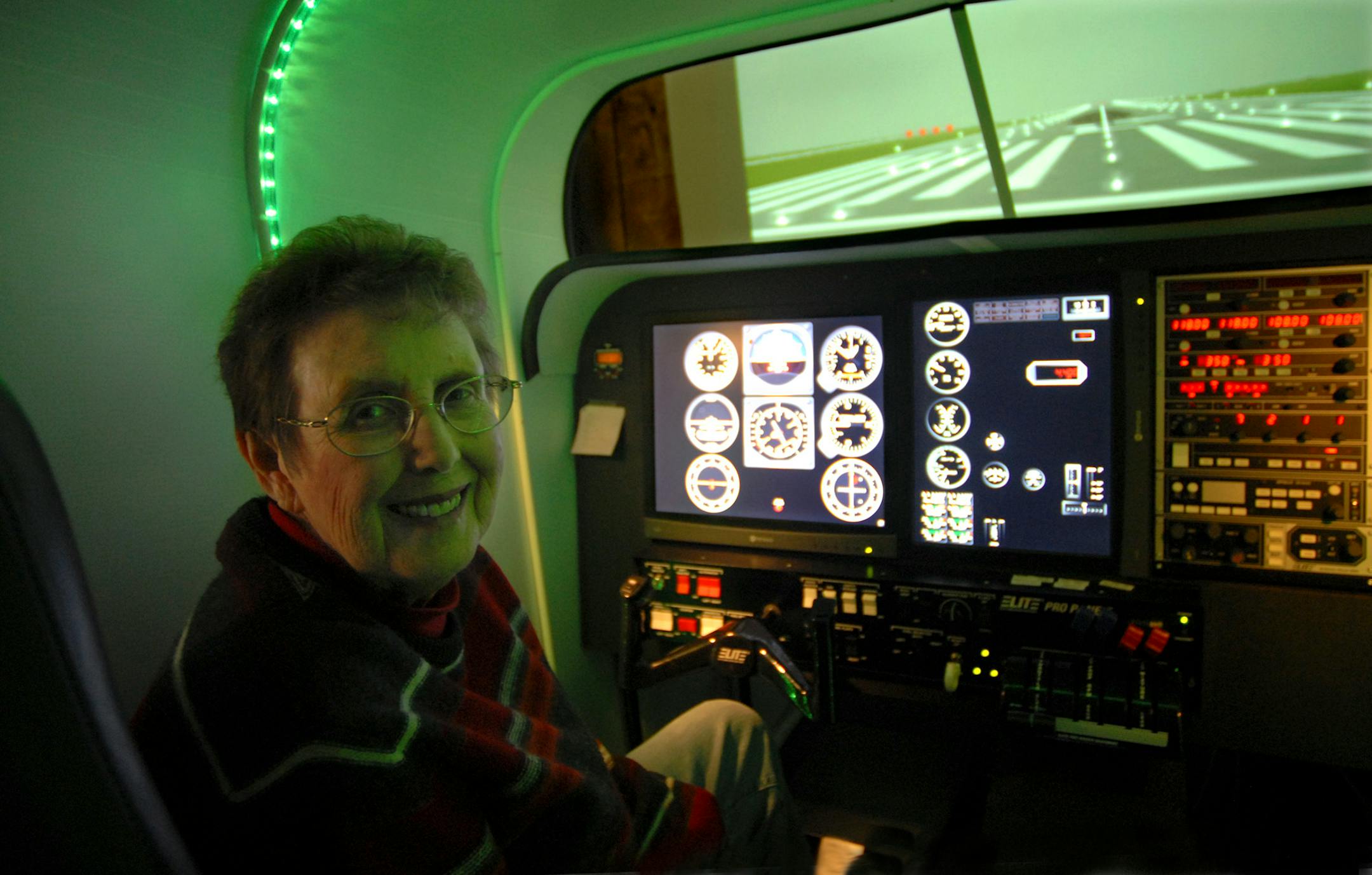 Master Flight Instructor Linda Dowdy sat in her flight simulator at Sim Flight Minnesota at the Anoka County Airport. The equipment simulates a single engine, multi-engine and turboprop.