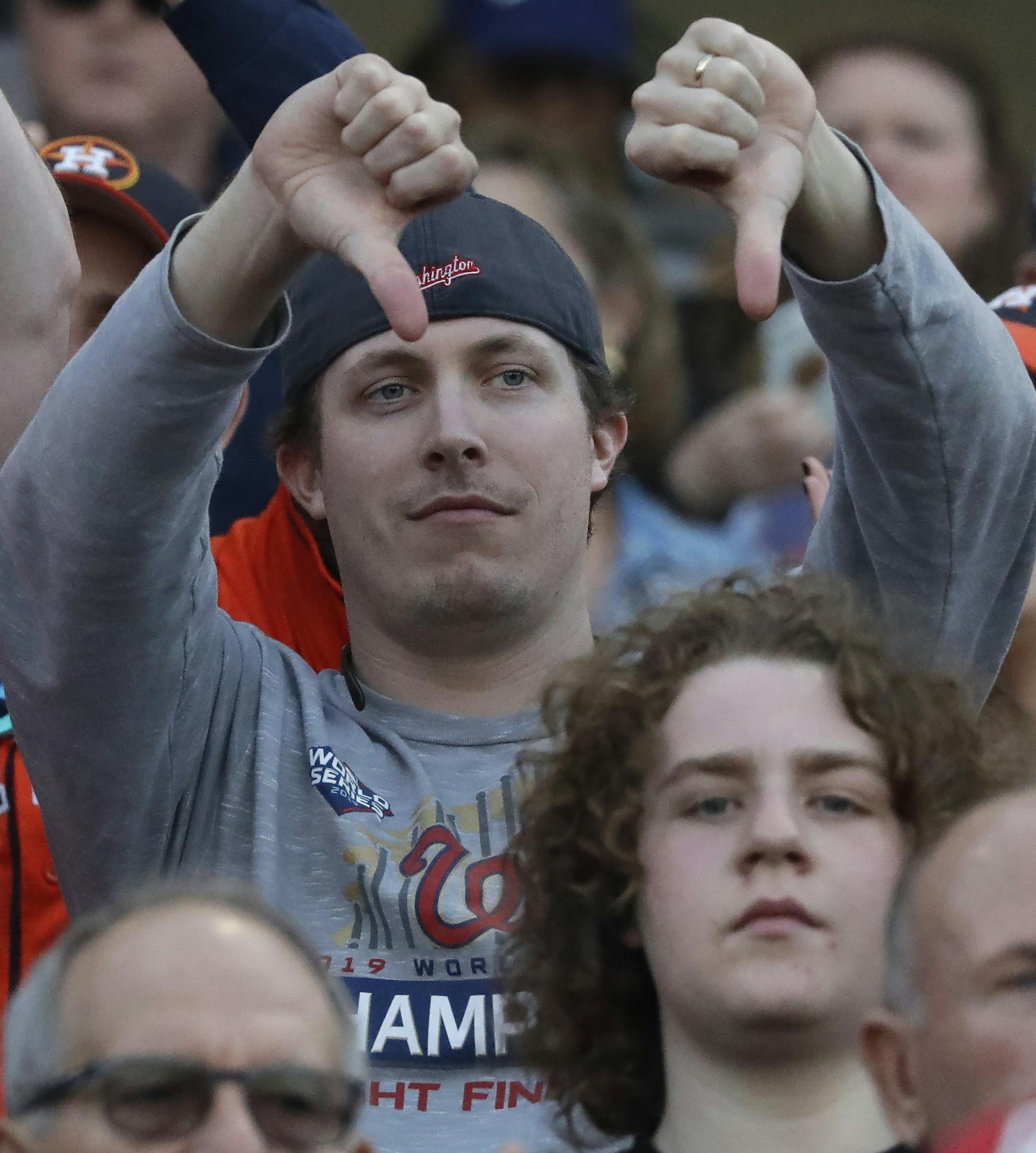 Fans reacts as the Houston Astros are introduced before facing the Washington Nationals in spring training baseball game Saturday, Feb. 22, 2020, in West Palm Beach, Fla. (AP Photo/John Bazemore)