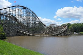 Sections of Valleyfair’s Excalibur roller coaster sit under water as the rising Minnesota River flooded rides and parking areas Wednesday in Shakope