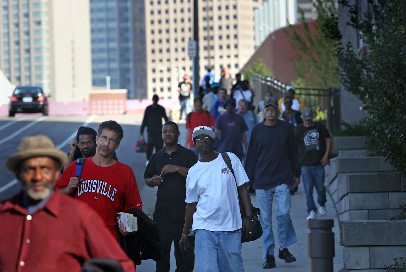 Men looking for housing made their way down the hill to line up for a place to stay at Higher Ground shelter in Minneapolis, Thursday September 26, 2013. ] (KYNDELL HARKNESS/STAR TRIBUNE) kyndell.harkness@startribune.com ORG XMIT: MIN1309261810293911