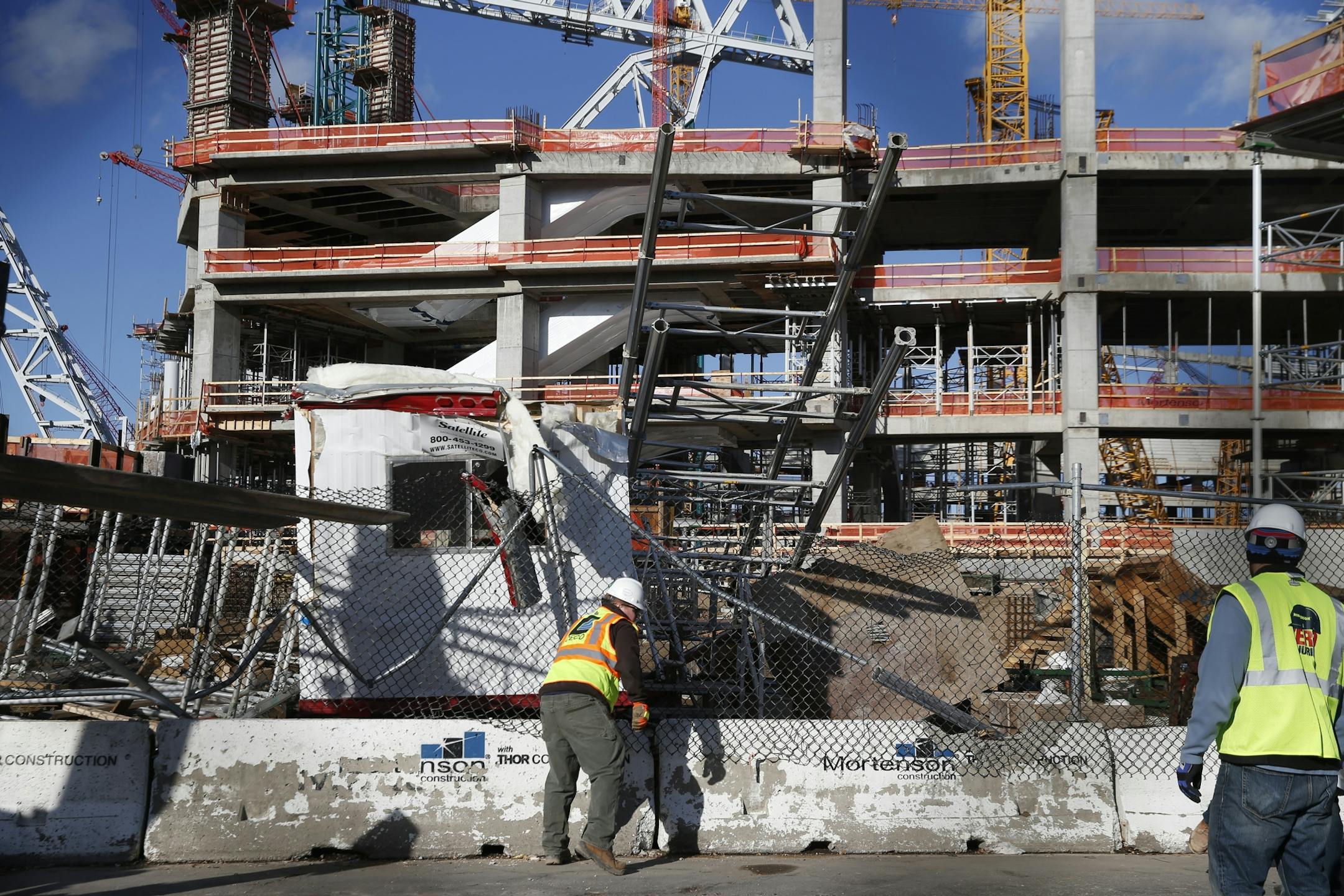 On the Sixth Street side of the new Vikings stadium, some scaffolding collapsed upon a trailer because of high winds Sunday.