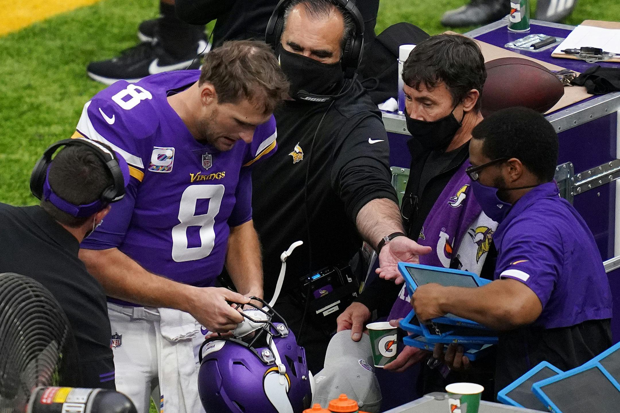 Minnesota Vikings quarterback Kirk Cousins (8) came off the field after he was unable to convert on downs in the first quarter.