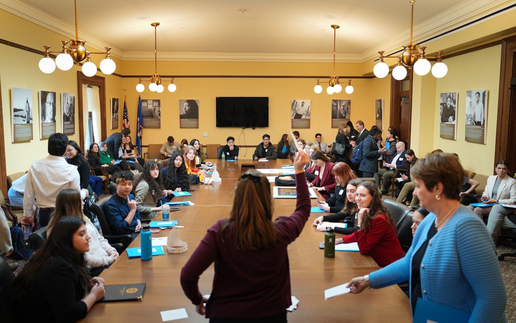Alison Groebner, center, director of government and community relations for the Minnesota Private College Council, speaks to students after they met with legislators around the State Capitol hoping to gain funding for more scholarships for students at Minnesota’s private colleges.