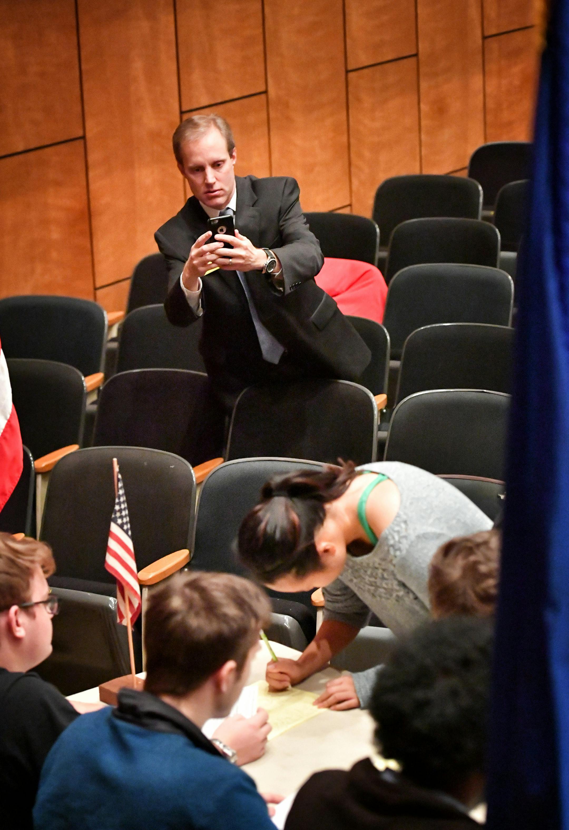 Minnesota Secretary of State Steve Simon photographed the first group of como Park HS students signing up to vote at the start of mock election day at Como Park HS. ] GLEN STUBBE * gstubbe@startribune.com Tuesday, October 25, 2016 this time: It's mock election day at Como Park HS, the perfect time to watch democracy in action and see how kids are responding to the polarized election. Kids will be coming into "polling places" to cast votes, part of a statewide high school mock presidential electi